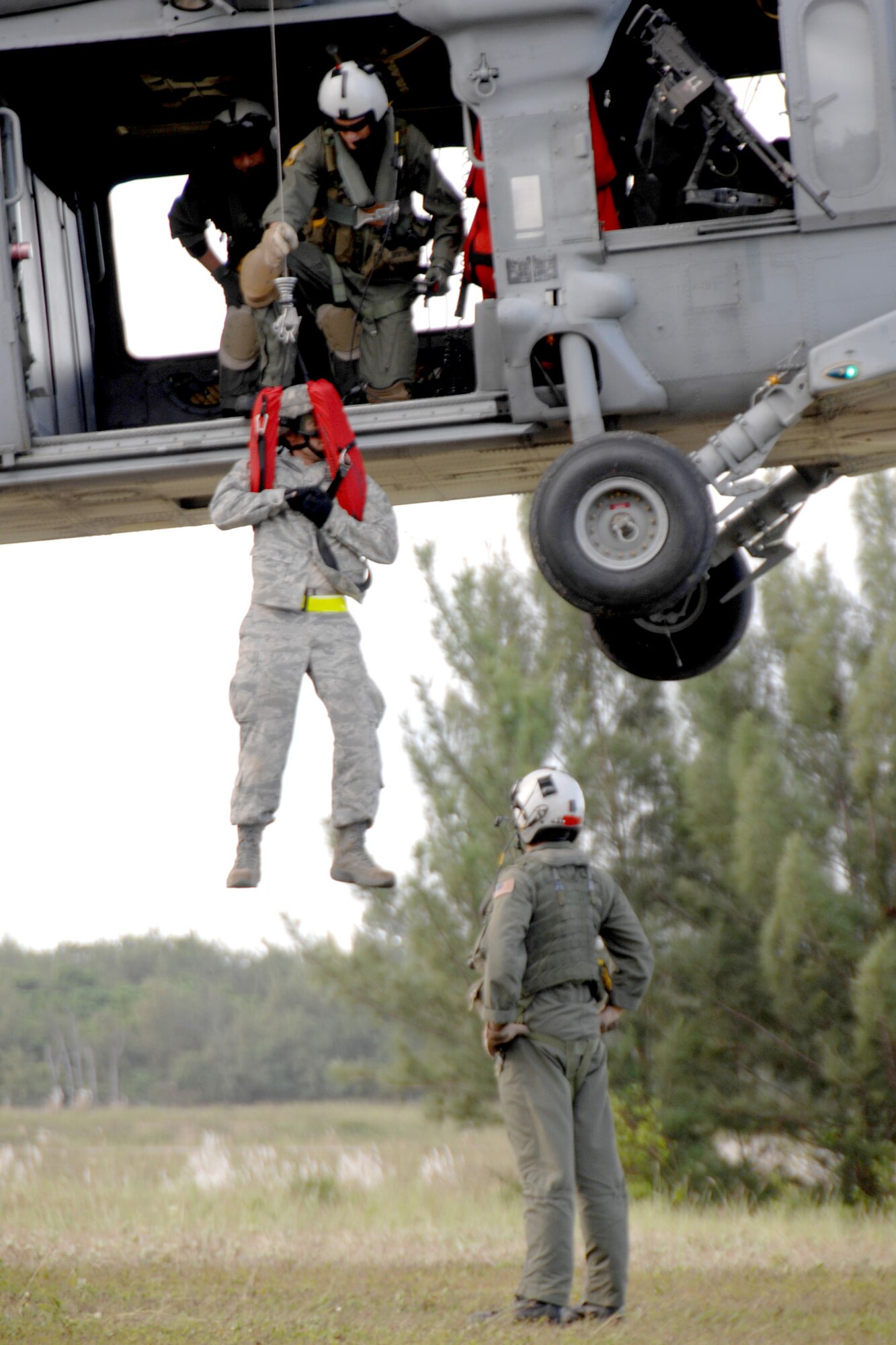 Servicemembers assigned to the 36th Mobility Response Squadron and HSC-25 conduct medical evacuation training Oct. 13, 2010, at Northwest Field, Guam. The joint field training exercise was performed in an effort to interchange and familiarize themselves with each other's tactics, techniques and procedures to be able to interoperate and conduct joint humanitarian assistance/disaster relief missions in the Pacific region. (U.S. Air Force photo/Airman 1st Class Anthony Jennings) 