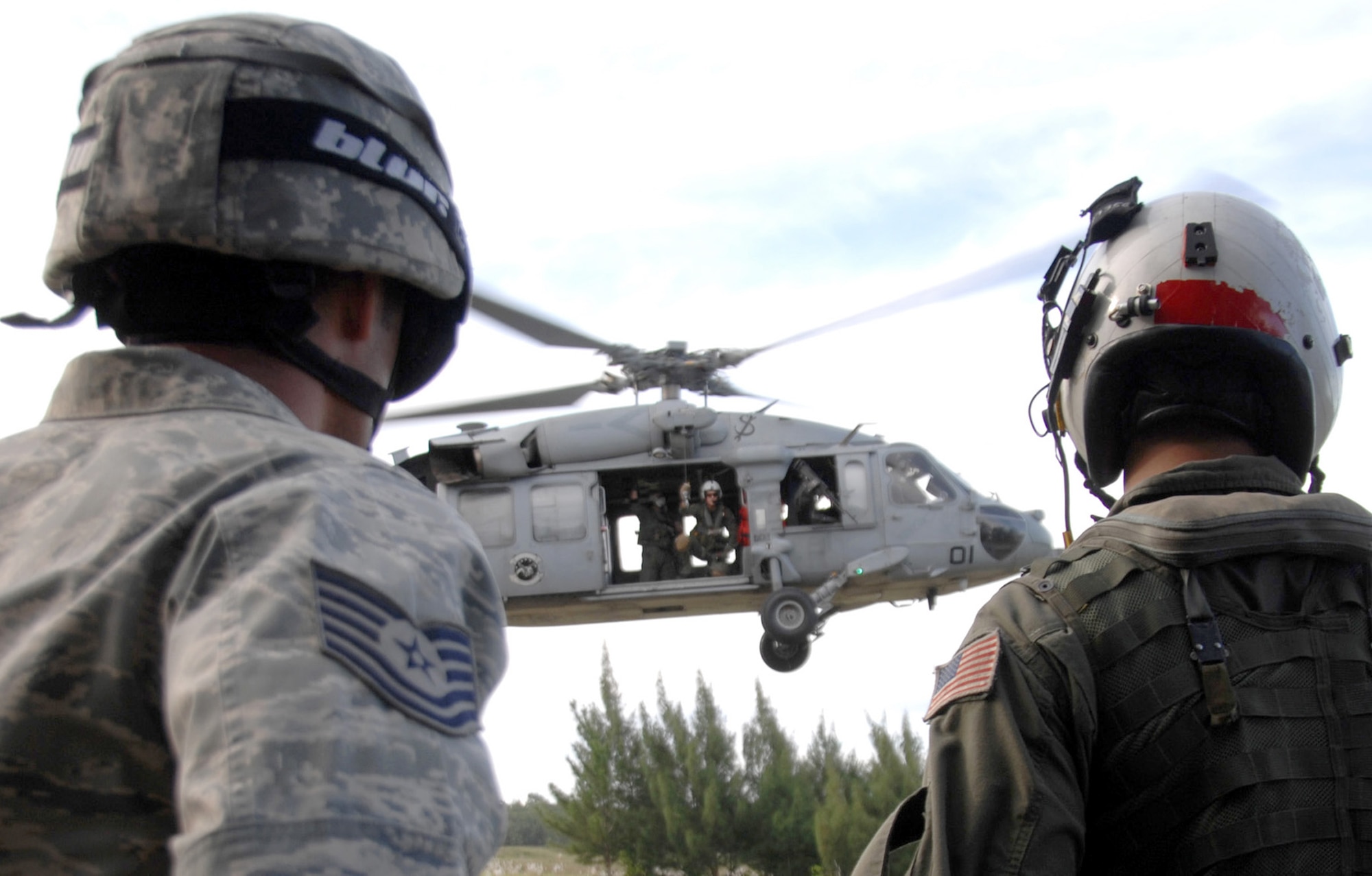 Servicemembers assigned to the 36th Mobility Response Squadron and HSC-25 conduct medical evacuation training Oct. 13, 2010, at Northwest Field, Guam. The joint field training exercise was performed in an effort to interchange and familiarize themselves with each other's tactics, techniques and procedures to be able to interoperate and conduct joint humanitarian assistance/disaster relief missions in the Pacific region. (U.S. Air Force photo/Airman 1st Class Anthony Jennings) 