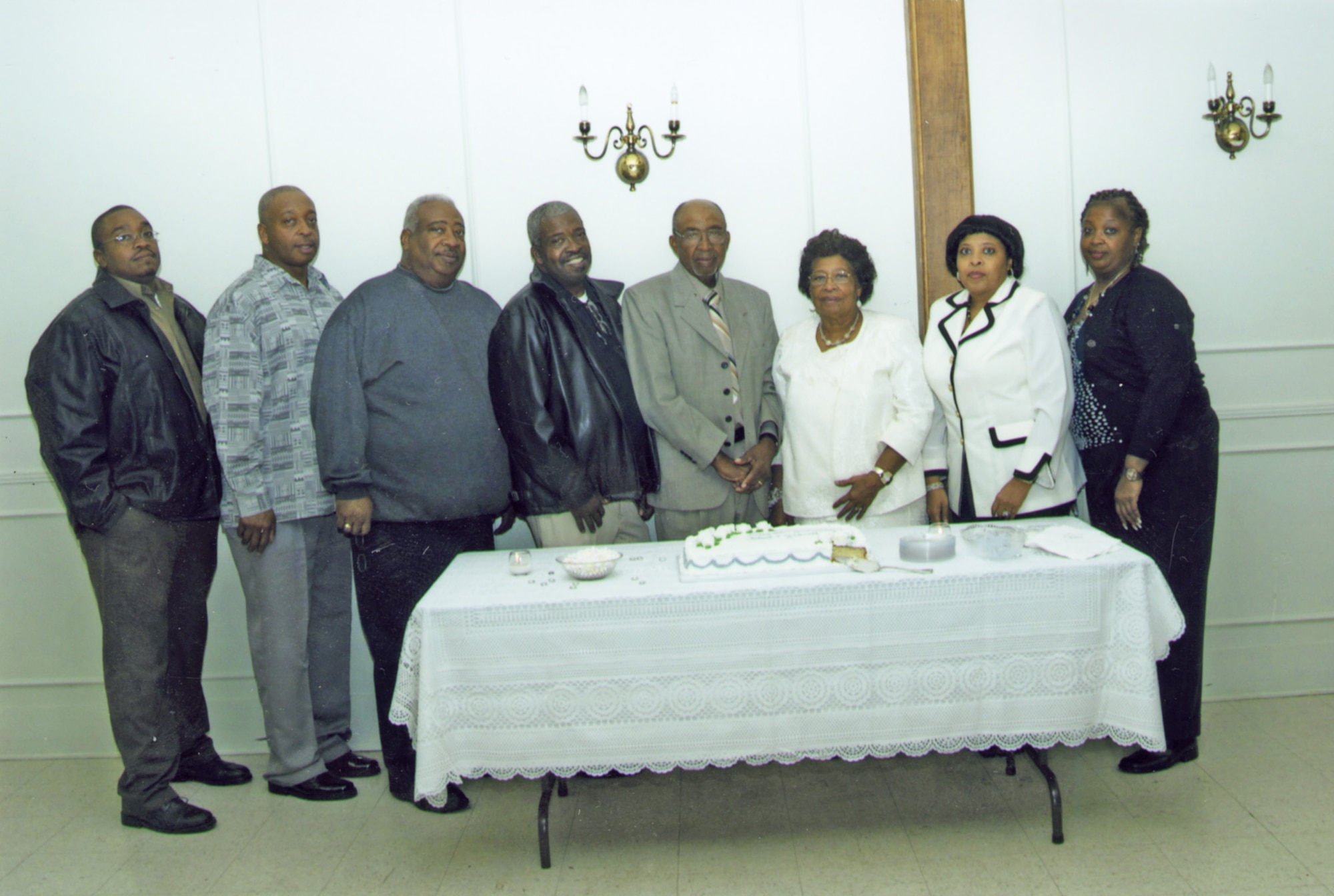 From left to right, On Oct. 31, 2009, brothers Scottie, Maverick, Jeff and Dwight Mosley pose for a family photo with their parents, Robert and Janette Mosley, and sisters Marie and Serbrinne Mosley during their parent’s 60th wedding anniversary. (Photo provided)

