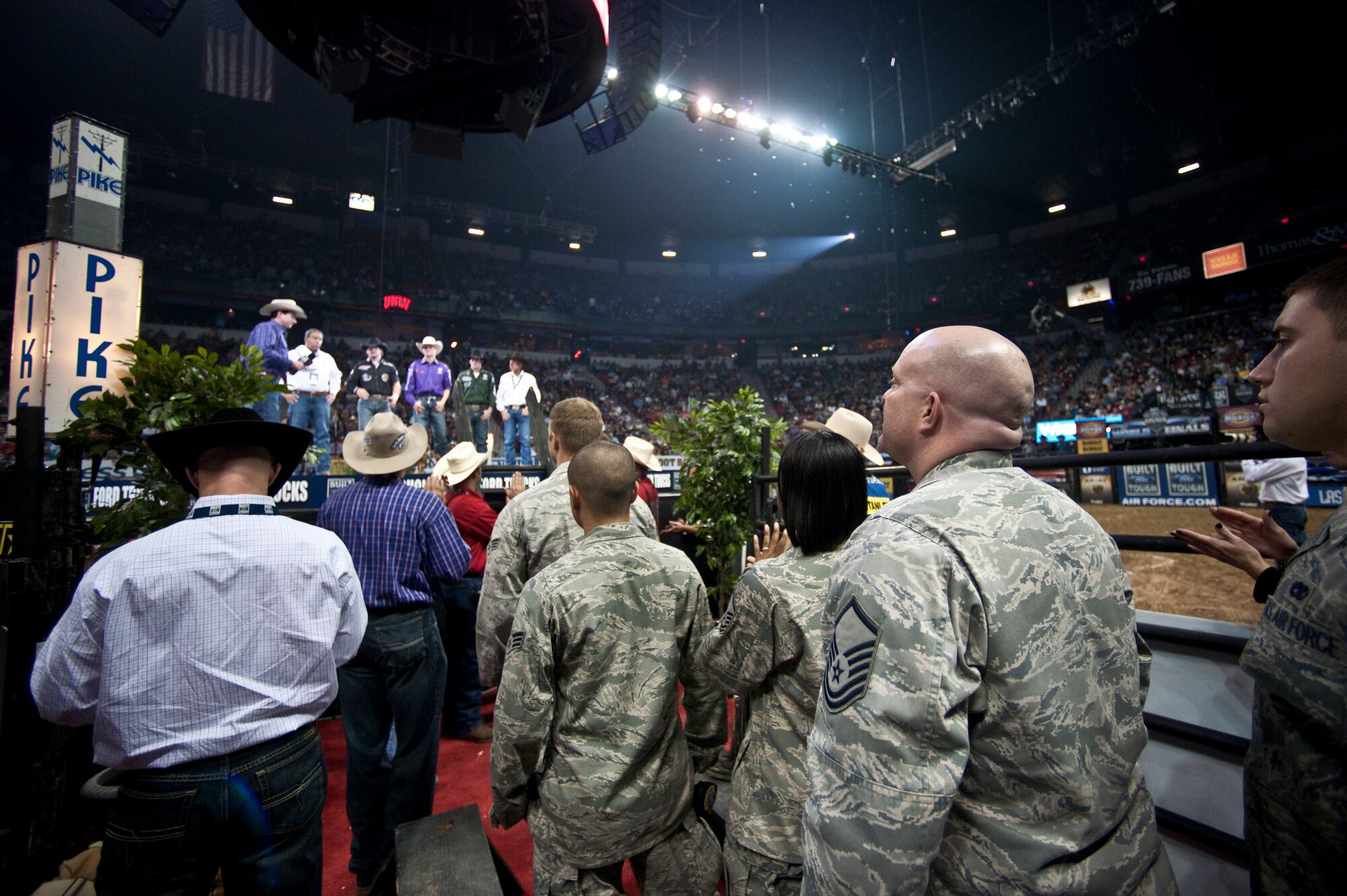 LAS VEGAS--  Master Sgt. Jeramie Brown, 99th Air Base Wing Public Affairs broadcast journalist, waits off-stage with his fellow Airmen from Nellis Air Force Base before being introduced during the intermission of the Professional Bull Riding Finals at the Thomas and Mack Center Oct. 22. The Airmen were honored for their service to the country during Air Force night at the PBR Finals .  (U.S. Air Force photo / Tech. Sgt. Michael R. Holzworth)
