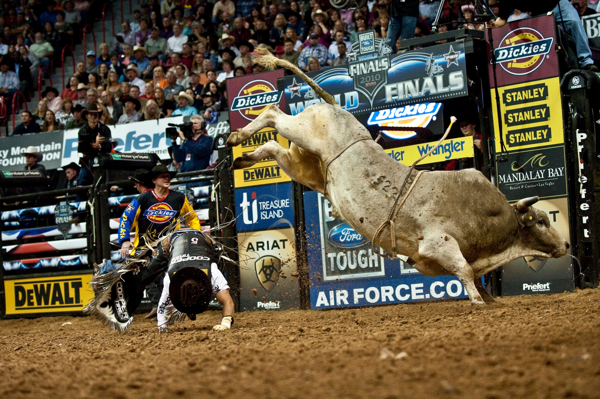 LAS VEGAS--  Professional bull rider Robson Palermo gets thrown from a bull during the Professional Bull Riding Finals at the Thomas and Mack Center Oct. 22. Airmen from Nellis Air Force Base were honored for their service to the country during Air Force night at the PBR Finals.  (U.S. Air Force photo / Tech. Sgt. Michael R. Holzworth)
