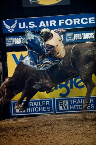 LAS VEGAS-- Professional bull rider Robson Palermo does his best to hold on during the Professional Bull Riding Finals at the Thomas and Mack Center Oct. 22.   Airmen from Nellis Air Force Base were honored for their service to the country during Air Force night at the PBR Finals .  (U.S. Air Force photo / Tech. Sgt. Michael R. Holzworth)