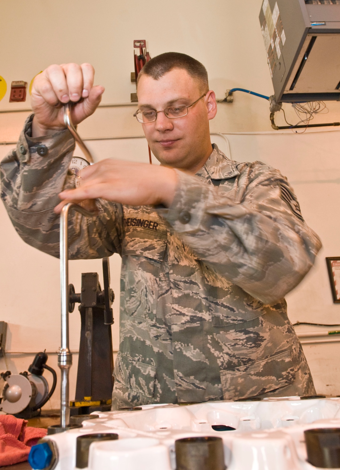 Staff Sgt. Eric Theisinger, 19th Component Maintenance Squadron hydraulic systems craftsman, assembles a C-130 brake Oct. 25. The Tonica, Ill., native supervises the production of more than 328 C-130 brakes annually, supporting five flying squadrons, two major commands and overseas contingency operations. (U.S. Air Force photo by Staff Sgt. Nestor Cruz)