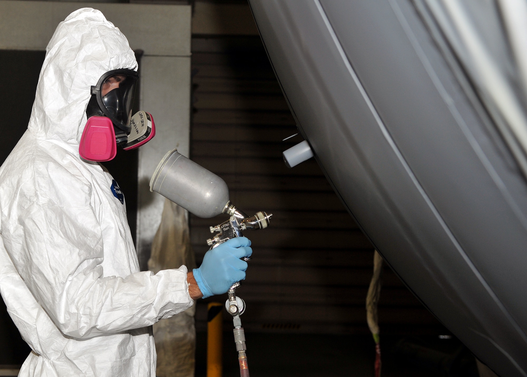 Airman 1st Class Jacob Petty, 19th Equipment Maintenance Squadron corrosion control apprentice, spray paints a C-130 Hercules Oct. 20. Corrosion control is key to caring for aging aircraft, preventing structural damage and failure and ultimately saving the Air Force millions of dollars. (U.S. Air Force photo by Senior Airman Gul Crockett)
