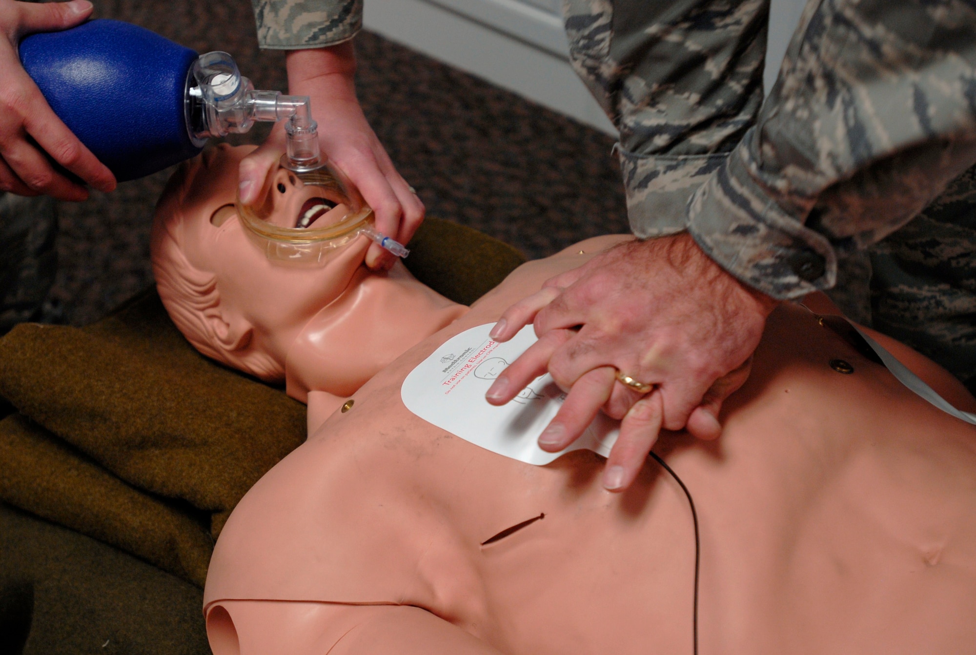 A life-size Medi-Man dummy helps Airmen practice cardiopulmonary resuscitation and automated external defibrillator simulations to understand the importance of proper form. (U.S. Air Force photo/Airman 1st Class Jessica Hines)