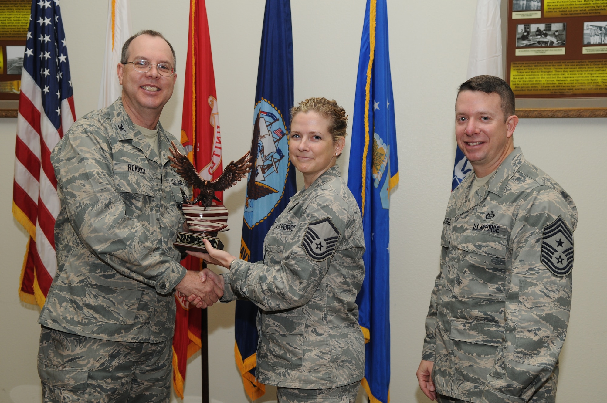 GOODFELLOW AIR FORCE BASE, Texas --Master Sgt. Stephanie Barre, 17th Training Group, accepts her Team Goodfellow Senior Noncommissioned Officer of the Quarter award for the third quarter from Col. David Rearick, 17th Training Wing Vice Commander, and Chief Master Sgt. Brendan Criswell, 17th TRW Command Chief, at the awards breakfast Oct. 26.