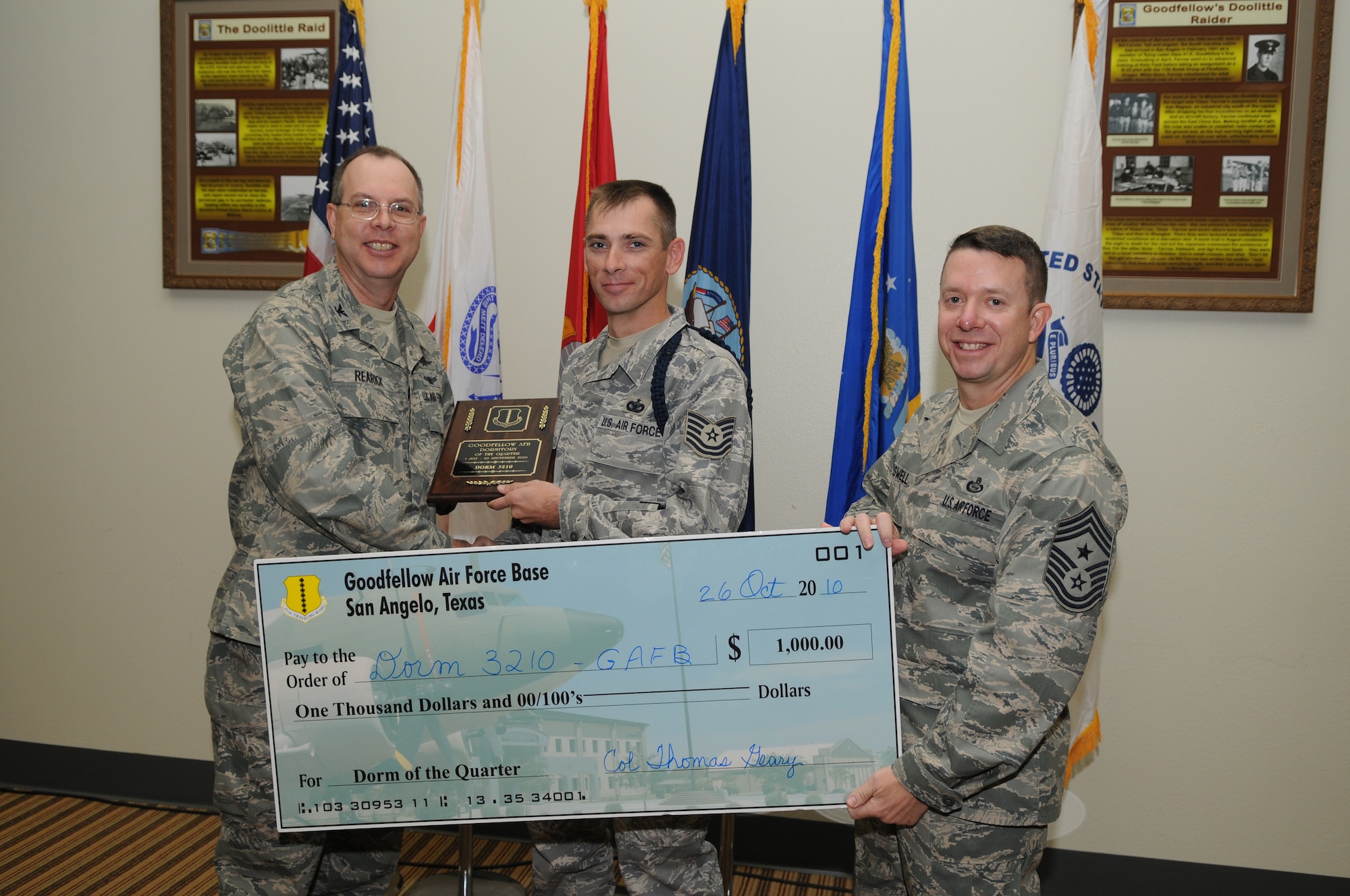 GOODFELLOW AIR FORCE BASE, Texas -- Tech. Sgt. Kenneth Kimble, 315th Training Squadron, accepts the third quarter Dormitory of the Quarter Award for the 315th TRS dorm 3210 from Col. David Rearick, 17th Training Wing Vice Commander, and Chief Master Sgt. Brendan Criswell, 17th TRW Command Chief, during the awards breakfast Oct. 26. (U.S. Air Force photo/Airman 1st Class Clayton Lenhardt)
