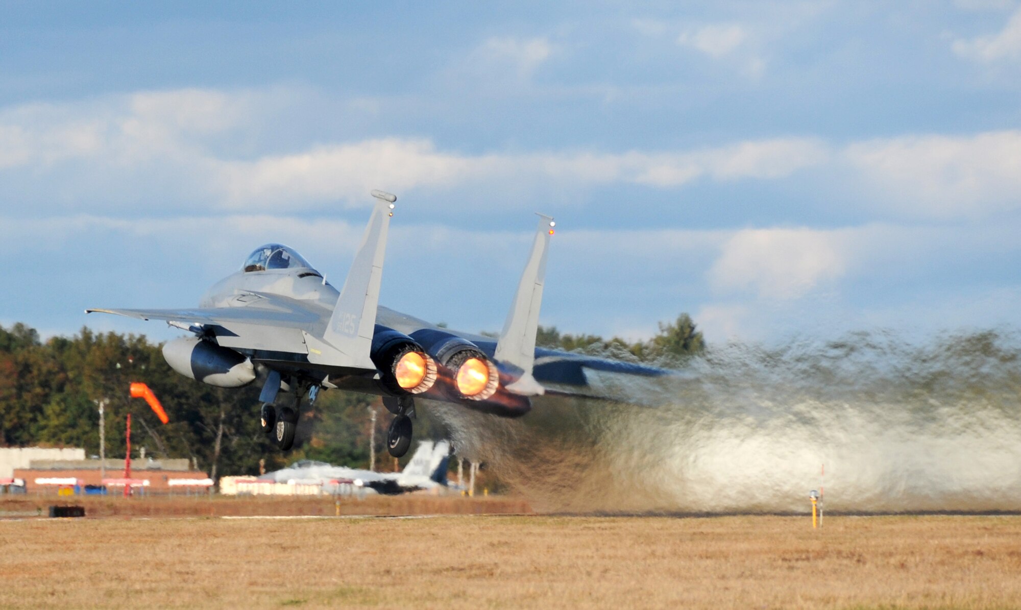 An F-15 Eagle takes off from Barnes Air National Guard Base, Mass., while participating in a training mission Oct. 21, 2010.  The Massachusetts Air National Guard's 104th Fighter Wing provides air sovereignty alert support, protecting the northeastern United States.  (U.S. Air Force photo/Master Sgt. Mark Fortin) 