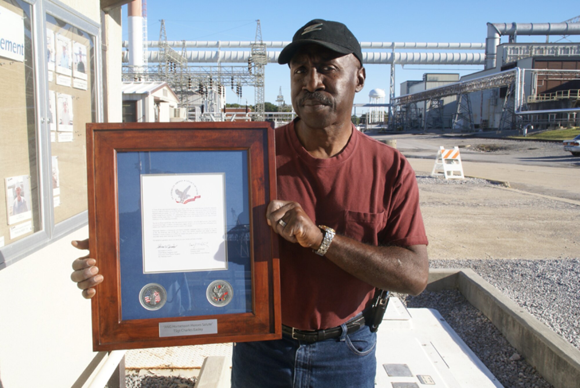 Charles Easley, an Aerospace Testing Alliance fuels specialist at AEDC, poses with a Hometown Hero award certificate the retired Air Force Master Sergeant recently received for his 32 years of military service, including deploying with the 118th Air National Guard during Operation Iraqi Freedom in 2003. (Photo by Philip Lorenz III)