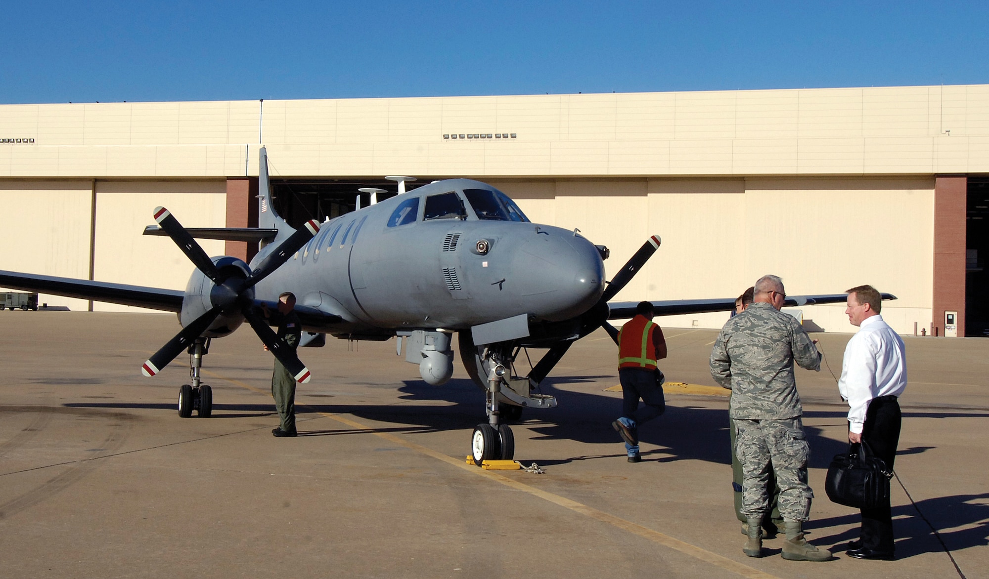 An Air National Guard-operated RC-26 jet made a brief stop Oct. 15 at Tinker, giving Oklahoma City Air Logistics Center leadership and some Contract Logistics Support personnel an opportunity to view the unique aircraft.  The RC-26 aids in domestic emergency relief with its ability to stay over an affected area for long periods and has been valuable during wildfire fighting and the recent oil spill cleanup in the Gulf of Mexico. (Air Force photo by Margo Wright)
