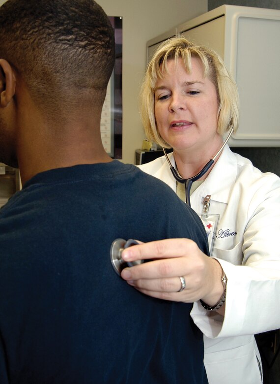 Dr. (Maj.) Angela Albrecht, 72nd Medical Operations Support Medicine Clinic director, sees a patient in Tinker’s family medicine clinic. (Air Force photo by Margo Wright)