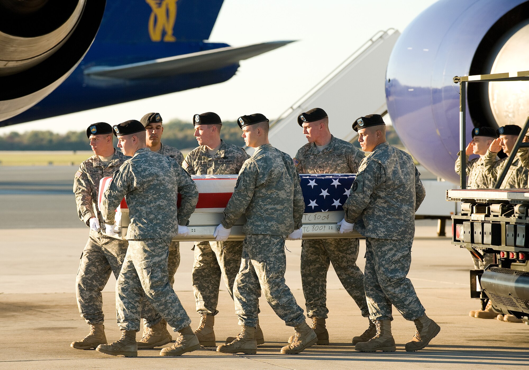 A U.S. Army carry team transfers the remains of Army Spc. Gerald R. Jenkins of Circleville, Ohio at Dover Air Force Base, Del., Oct. 22, 2010. Jenkins was assigned to the 1st Brigade Special Troop Battalion, 1st Brigade Combat Team, 101st Airborne Division, Fort Campbell, Ky. (U.S. Air Force photo/Jason Minto)