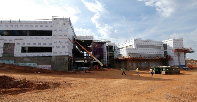 The three-floor 72nd Medical Group building, shown here from the back side, is scheduled to be completed in the fall of next year. Just inside the Gott Gate on the south side of Tinker, the 171,000 square foot facility will feature an open design in the center with an atrium allowing more natural light, reducing artificial lighting needs and saving energy dollars. (Air Force photo by Margo Wright)