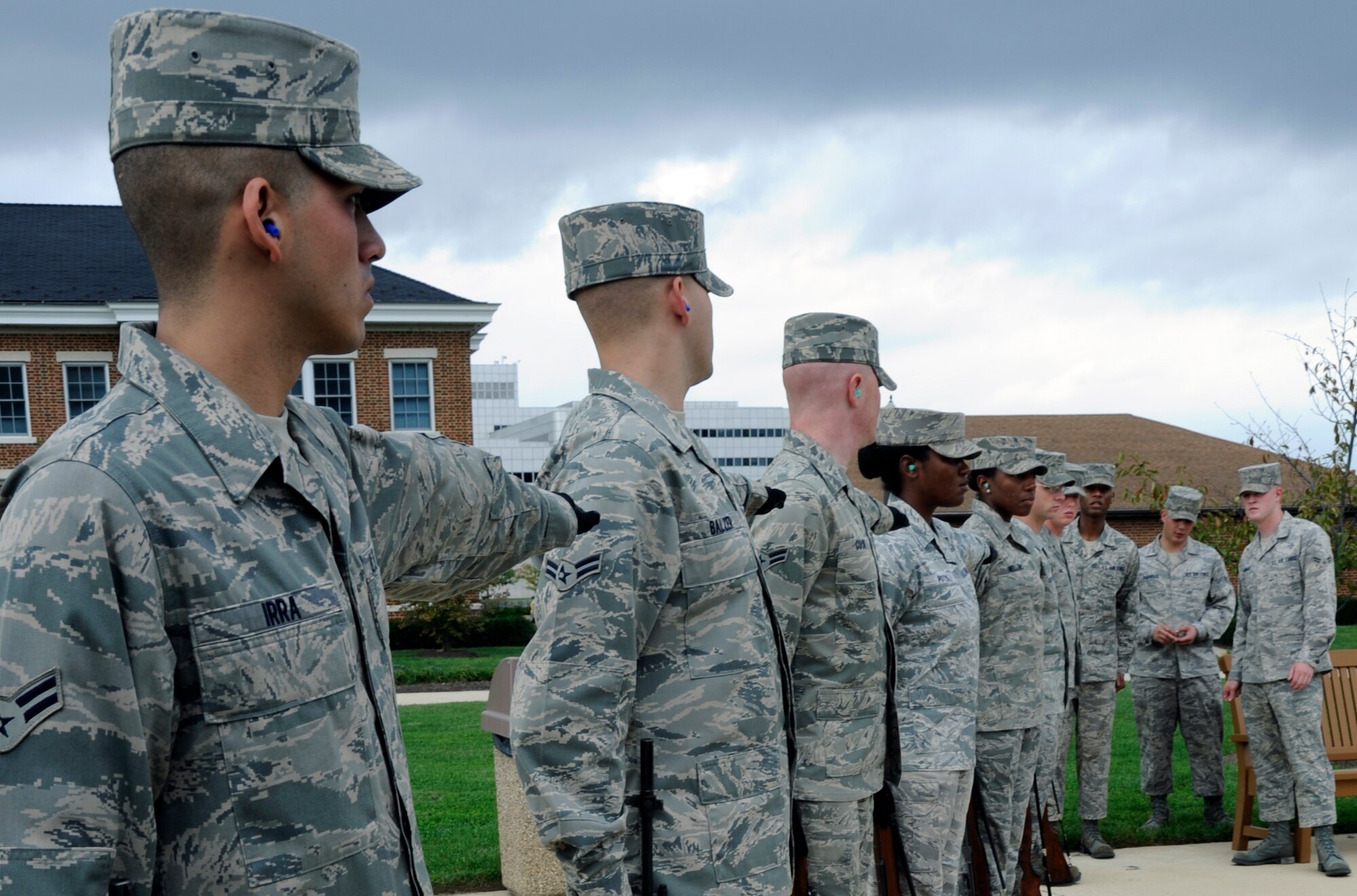 Airman 1st Class Robert Barnhart observes members of the U.S. Air Force Honor Guard's firing party as they practice drill movements, Oct. 25, 2010, at Bolling Air Force Base, D.C. Airman Barnhart is a firing party trainer with the USAF Honor Guard. (U.S. Air Force photo/Staff Sgt. Matthew Bates)