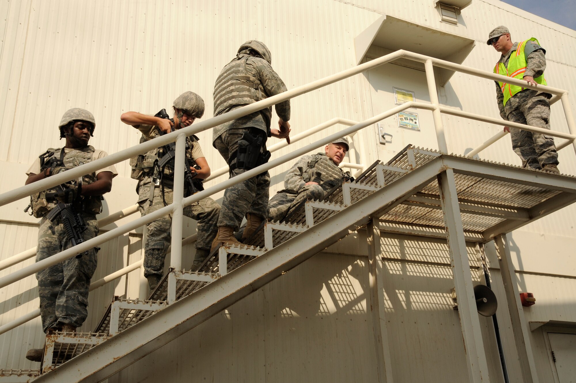 Airmen from the 380th Expeditionary Security Forces Squadron apprehend a
simulated active shooter played by Tech. Sgt. Alex Bell, 380th ESFS trainer,
during an exercise Oct. 23, 2010, at an undisclosed location in Southwest
Asia. Airmen from the 380th Air Expeditionary Wing practiced how to respond
to an active shooter during the exercise. (U.S. Air Force photo/Tech. Sgt.
April Wickes) 
