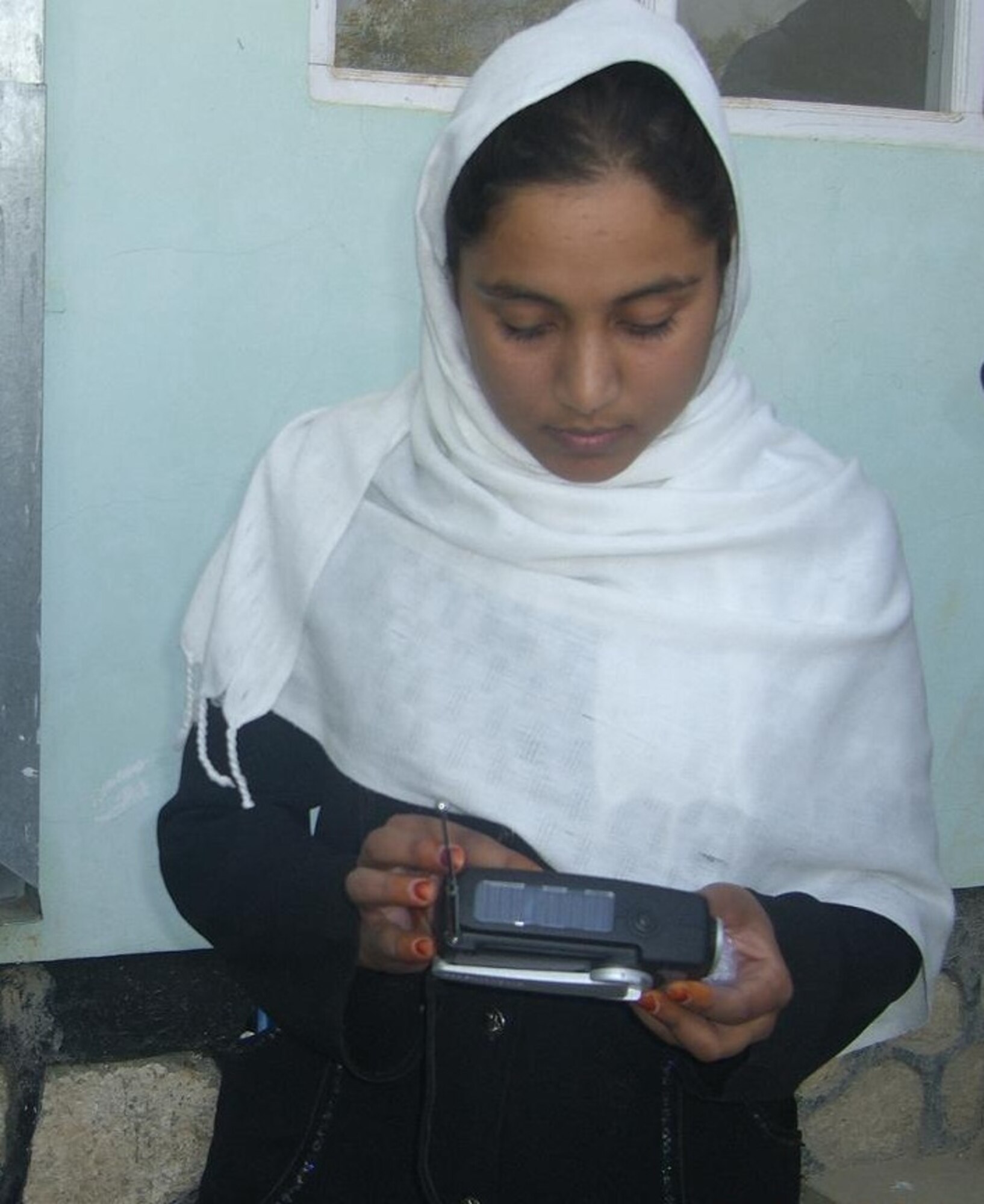MAZAR-E-SHARIF, Afghanistan - Afghan Air Force and NATO Air Training Command – Afghanistan Detachment 3 members distributed 1,500 radios to two suburb girls’ schools in Deh Dadi village near Mazar-e-Sharif on Sat., Oct. 23rd. (U.S. Air Force photo/RELEASED).