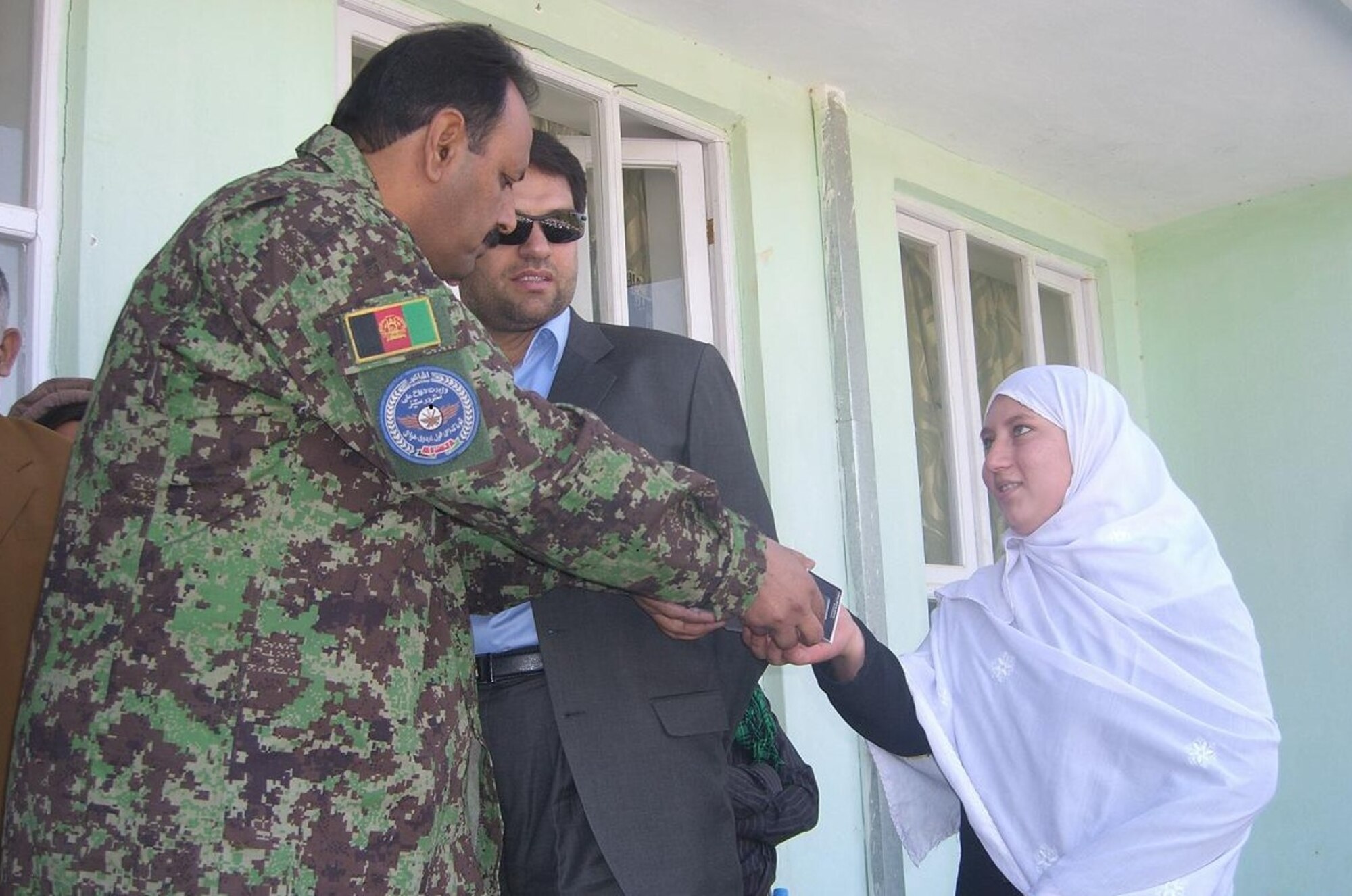 MAZAR-E-SHARIF, Afghanistan - Afghan Air Force and NATO Air Training Command – Afghanistan Detachment 3 members distributed 1,500 radios to two suburb girls’ schools in Deh Dadi village near Mazar-e-Sharif on Sat., Oct. 23rd. (U.S. Air Force photo/RELEASED).
