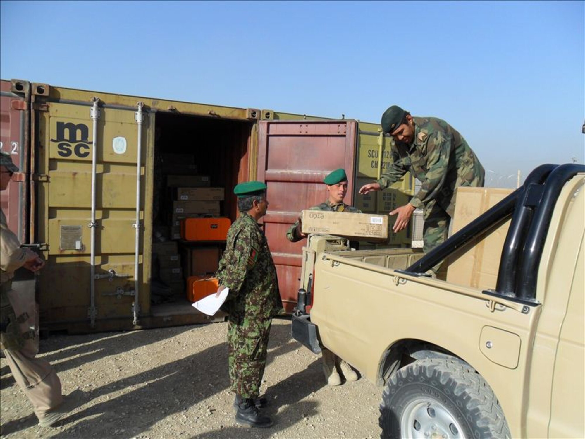 MAZAR-E-SHARIF, Afghanistan - Afghan Air Force and NATO Air Training Command – Afghanistan Detachment 3 members distributed 1,500 radios to two suburb girls’ schools in Deh Dadi village near Mazar-e-Sharif on Sat., Oct. 23rd. (U.S. Air Force photo/RELEASED).