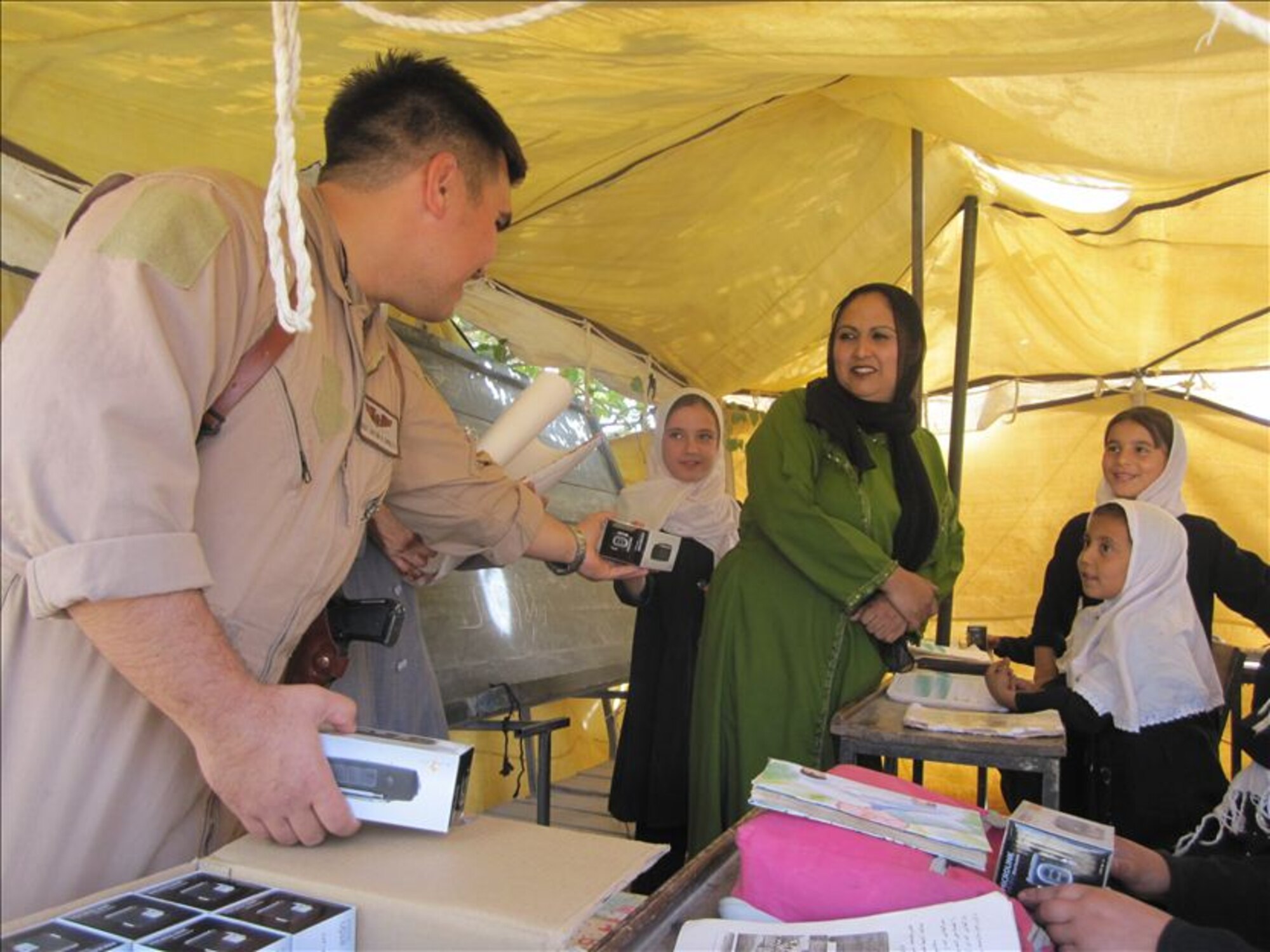 MAZAR-E-SHARIF, Afghanistan - Afghan Air Force and NATO Air Training Command – Afghanistan Detachment 3 members distributed 1,500 radios to two suburb girls’ schools in Deh Dadi village near Mazar-e-Sharif on Sat., Oct. 23rd. (U.S. Air Force photo/RELEASED).