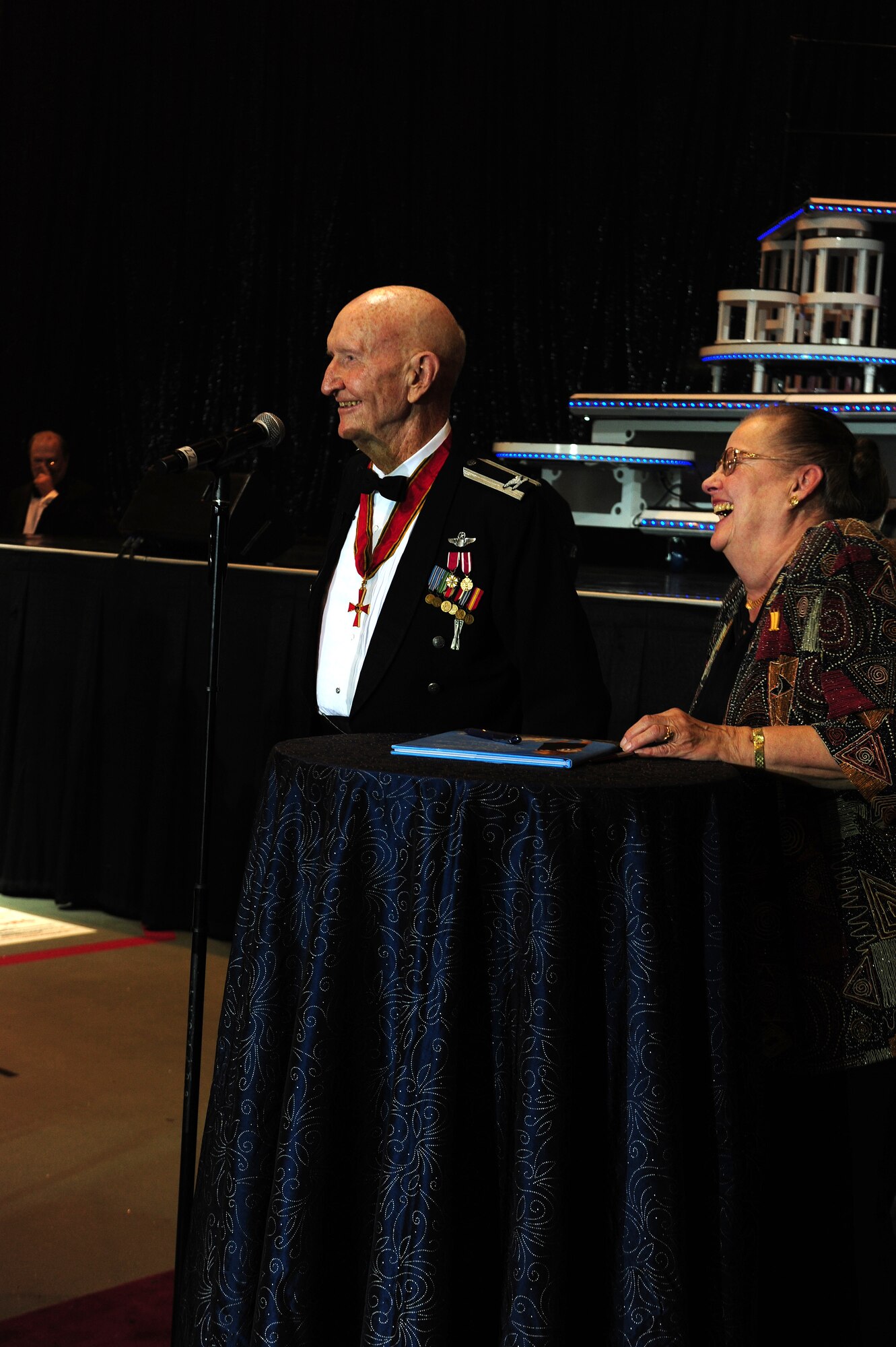 U.S. Air Force Ret Col. Gail "Berlin Candy Bomber" Halvorsen and Mercedes Wild share their story with guests at Ramstein's Air Force Ball, Oct. 16, 2010. The event celebrated the Air Force's 63rd birthday with entertainment including a cocktail hour, a Tops in Blue performance, dinner, dancing and more. (U.S. Air Force photo by Airman 1st Class Brea Miller)