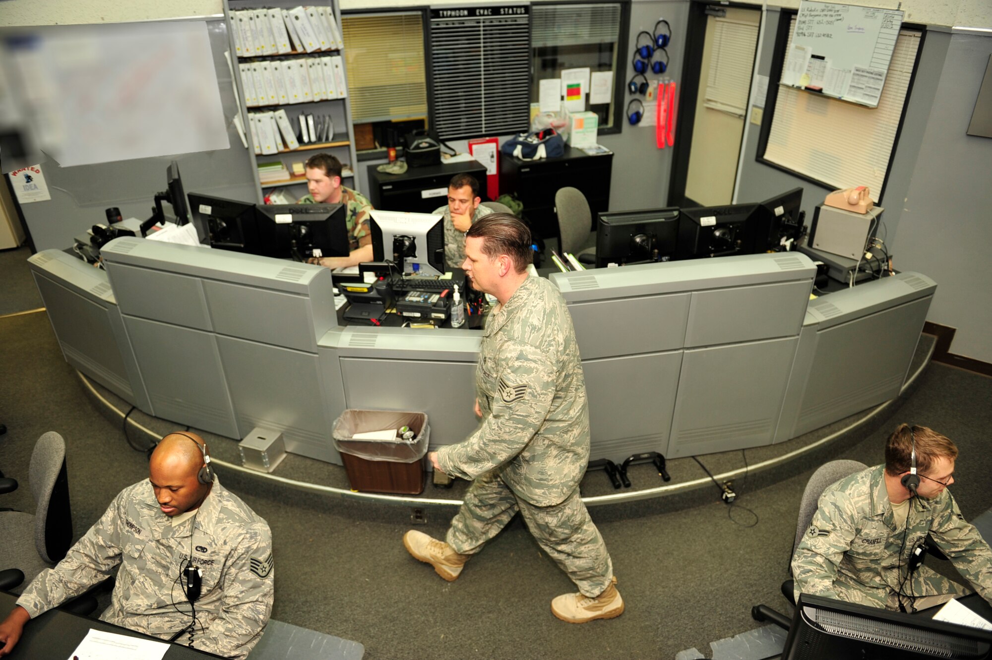 Members of the 18th  Maintenance Operations Center (MOC) coordinate between flight line agencies during the Beverly High 11-01 exercise here at Kadena Air Base, October 26, 2010. This  annual exercise is a tool used to rate Kadena personnel over all readiness for the real world war time mission. (U.S. Air Force photo/Staff Sgt. Lakisha Croley)