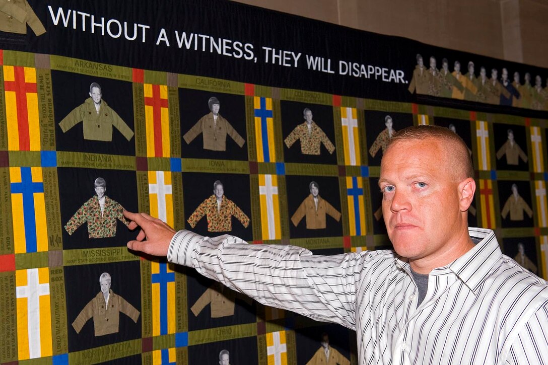 Matt Dalton, brother of U.S. Marine Corps. Cpl. Lance Thompson, points