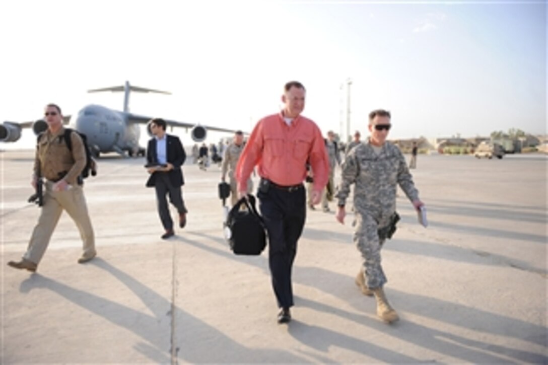 Deputy Secretary of Defense William J. Lynn III is escorted by Brig. Gen. Joseph DeSalvo after his arrival in Baghdad, Iraq, on Oct. 26, 2010.  Lynn is in Iraq to meet with military and civilian leaders and to visit with deployed troops.  