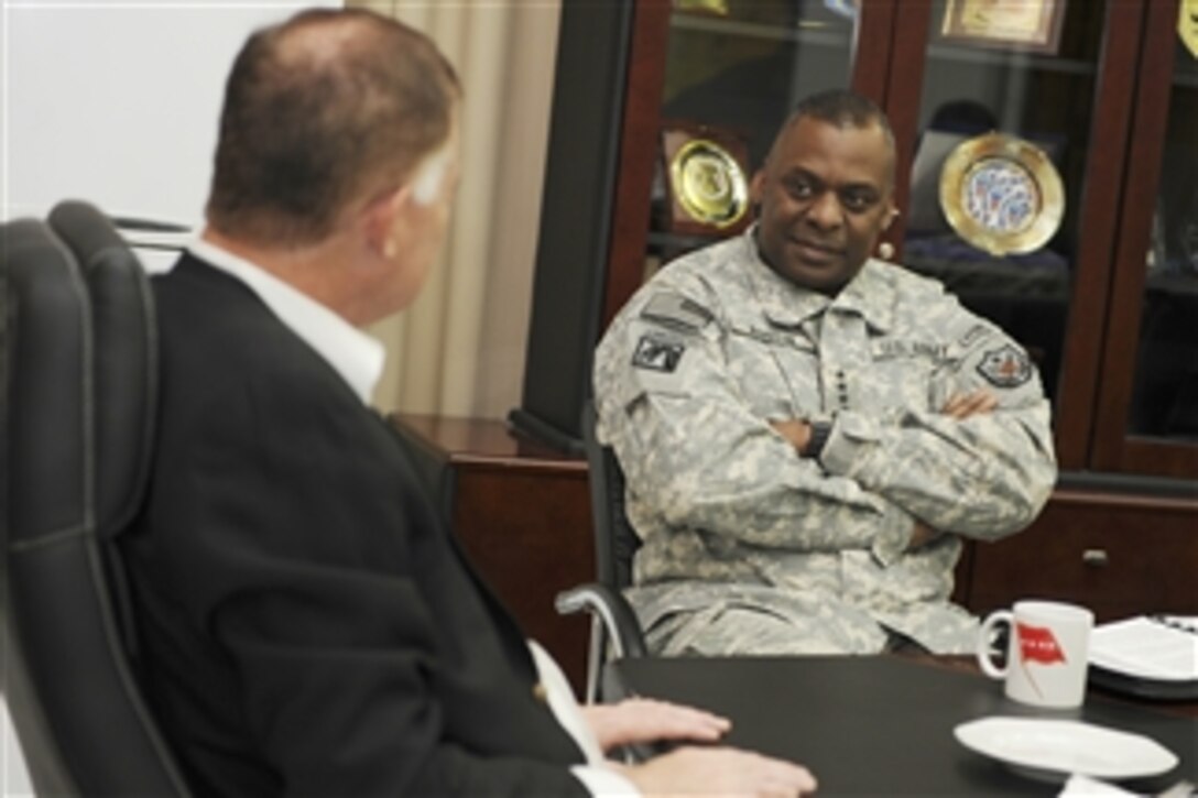 Deputy Secretary of Defense William J. Lynn III meets with Commander of U.S. Forces-Iraq Lt. Gen. Lloyd Austin in his office at the USF-I headquarters building in Baghdad, Iraq, on Oct. 26, 2010.  