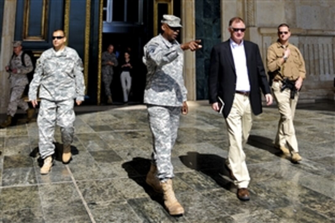 U.S. Deputy Defense Secretary William J. Lynn III walks with U.S. Army Gen. Lloyd J. Austin III, commander of U.S. Forces Iraq, at the headquarters building in Baghdad, Oct. 26, 2010.