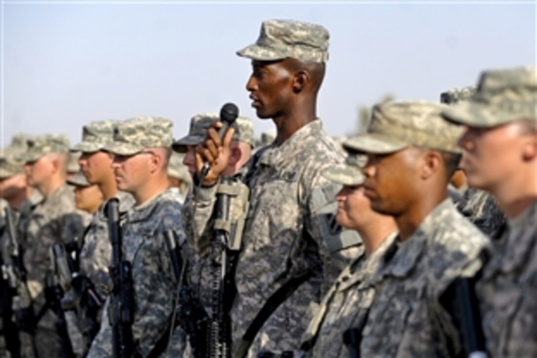 A U.S. Army soldier asks U.S. Deputy Defense Secretary William J. Lynn III a question during his visit to Baghdad, Oct. 26, 2010.