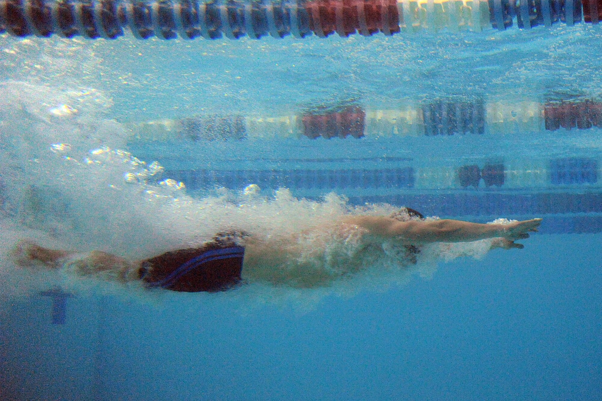 USARAK swimmer Drew Young dives into the Buckner Physical Fitness Center pool during his leg of the men’s 200-yard medley relay at the Oct. 21 swim meet. (U.S. Air Force photo/John Pennell)