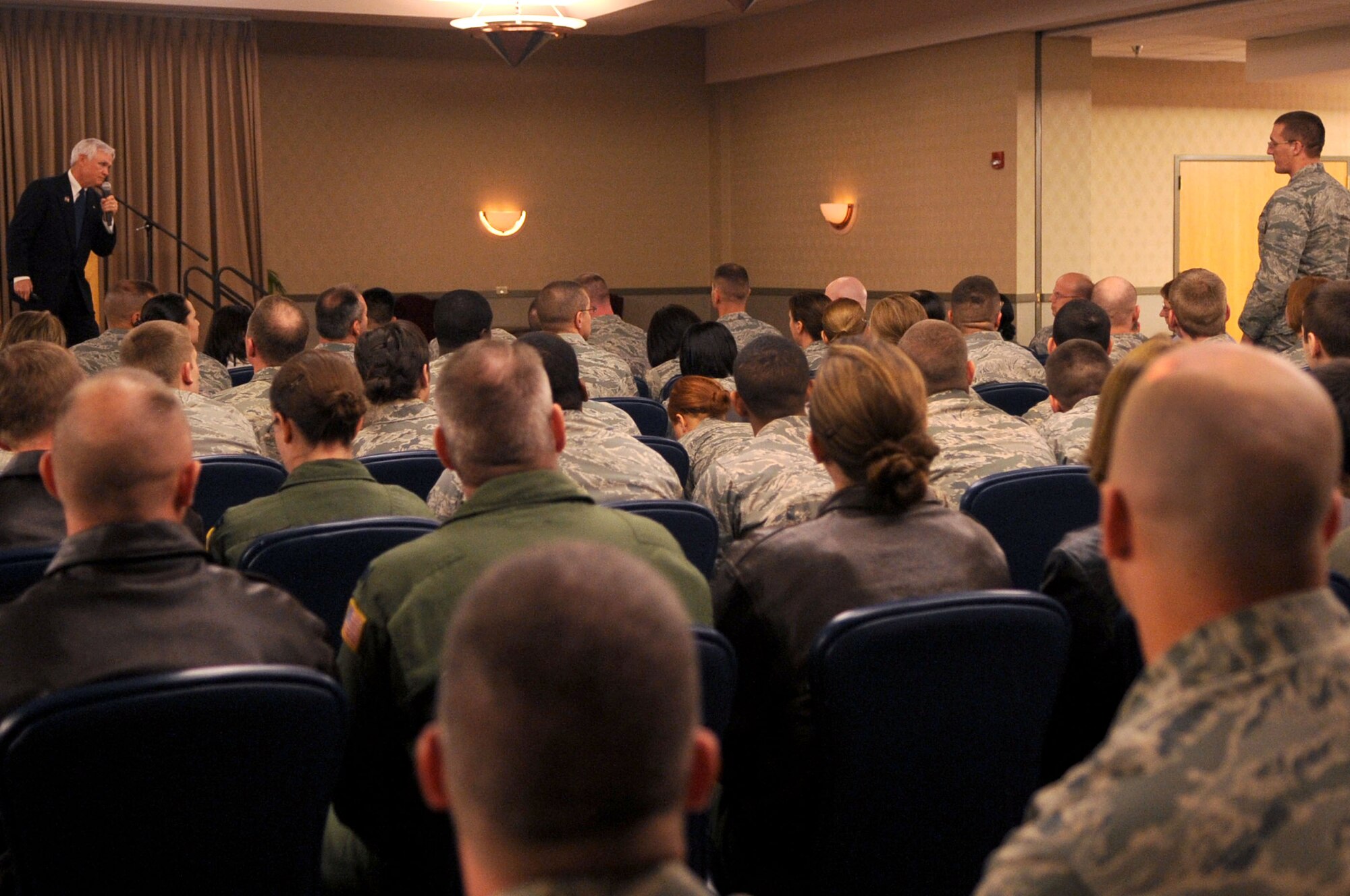 Retired Lt. Col. Barry Bridger, North Vietnam Prisoner of War survivor, answers a question from a Grand Forks Air Force Base member during his speech Oct. 27 at the Northern Lights Club on Grand Forks AFB.  Colonel Bridger was in the Grand Forks area sharing his POW story with the local community; he also travels around the world sharing his experience. (U.S. Air Force photo by Senior Airman Amanda N. Stencil)