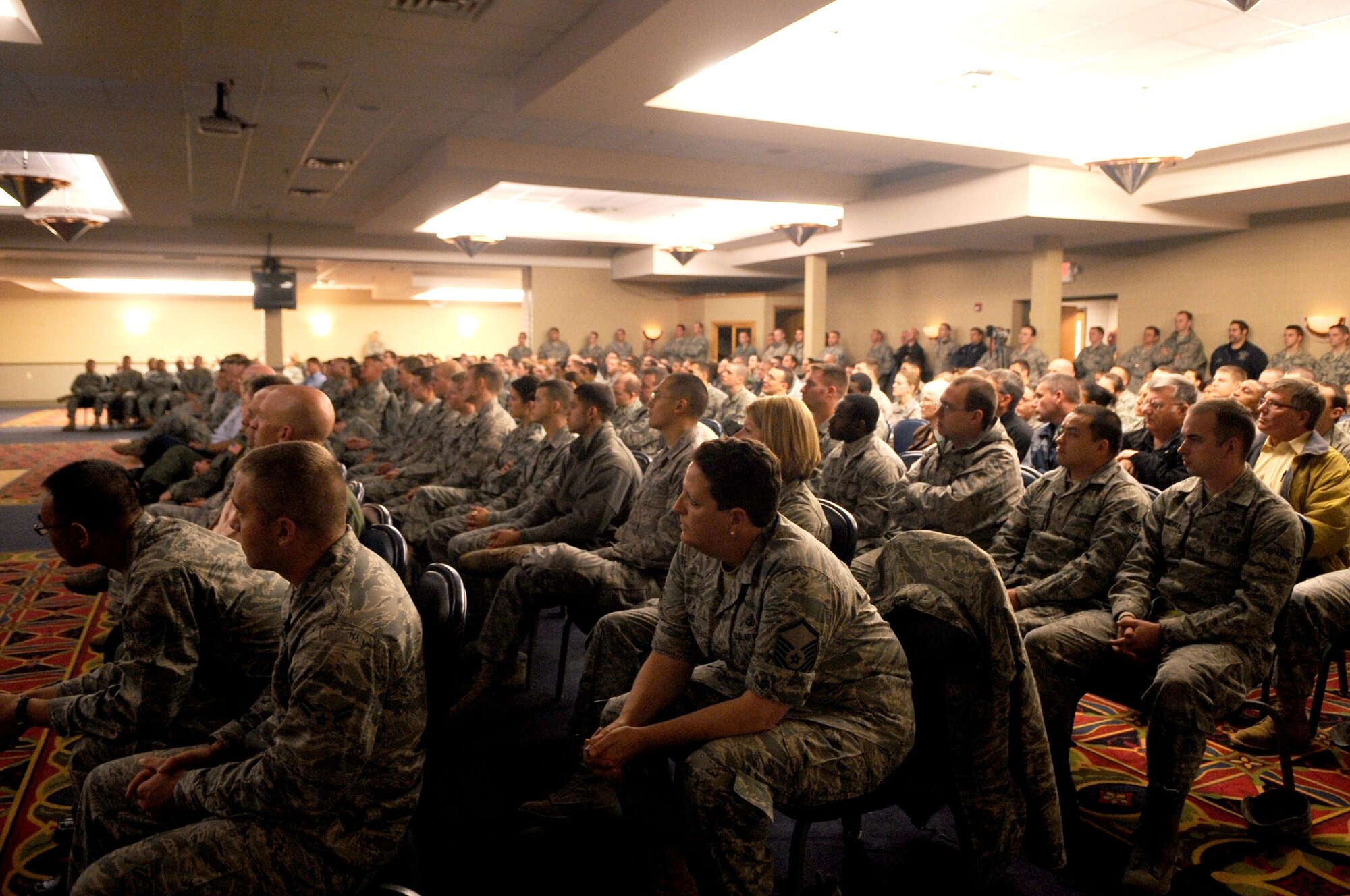 Members from Grand Forks Air Force Base listen intently to guest speaker retired Lt. Col. Barry Bridger, North Vietnam Prisoner of War survivor, Oct. 27 at the Northern Lights Club on Grand Forks AFB.  Colonel Bridger was in the Grand Forks area sharing his POW story with the local community; he also travels around the world sharing his experience. (U.S. Air Force photo by Senior Airman Amanda N. Stencil)