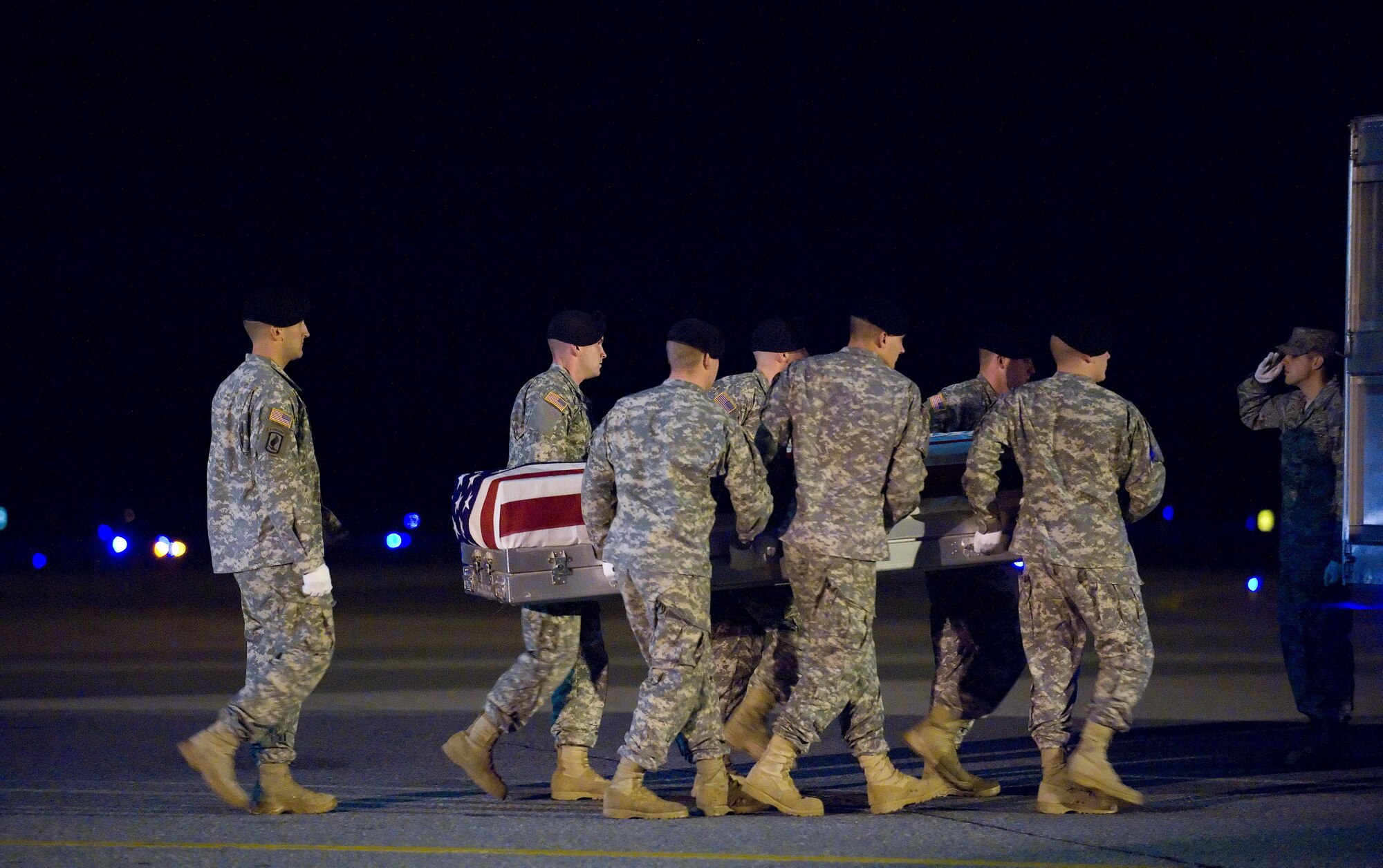 A U.S. Army carry team transfers the remains of Army Staff Sgt. Kenneth K. McAninch of Logansport, Ind., at Dover Air Force Base, Del., Oct. 23, 2010. He was assigned to the 1st Battalion, 506th Infantry Regiment, 4th Brigade Combat Team, 101st Airborne Division (Air Assault), Fort Campbell, Ky. (U.S. Air Force photo/Jason Minto)