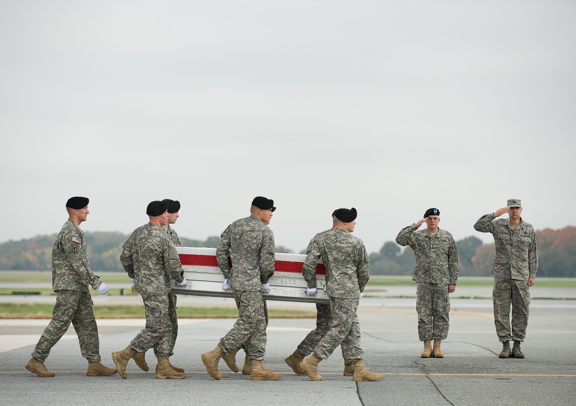 A U.S. Army carry team transfers the remains of Army Spc. Thomas A. Moffitt of Wichita, Kan., at Dover Air Force Base, Del., Oct. 26, 2010. He was assigned to the 2nd Battalion, 506th Infantry, 4th Brigade Combat Team, 101st Airborne Division (Air Assault), Fort Campbell, Ky. (U.S. Air Force photo/Jason Minto)