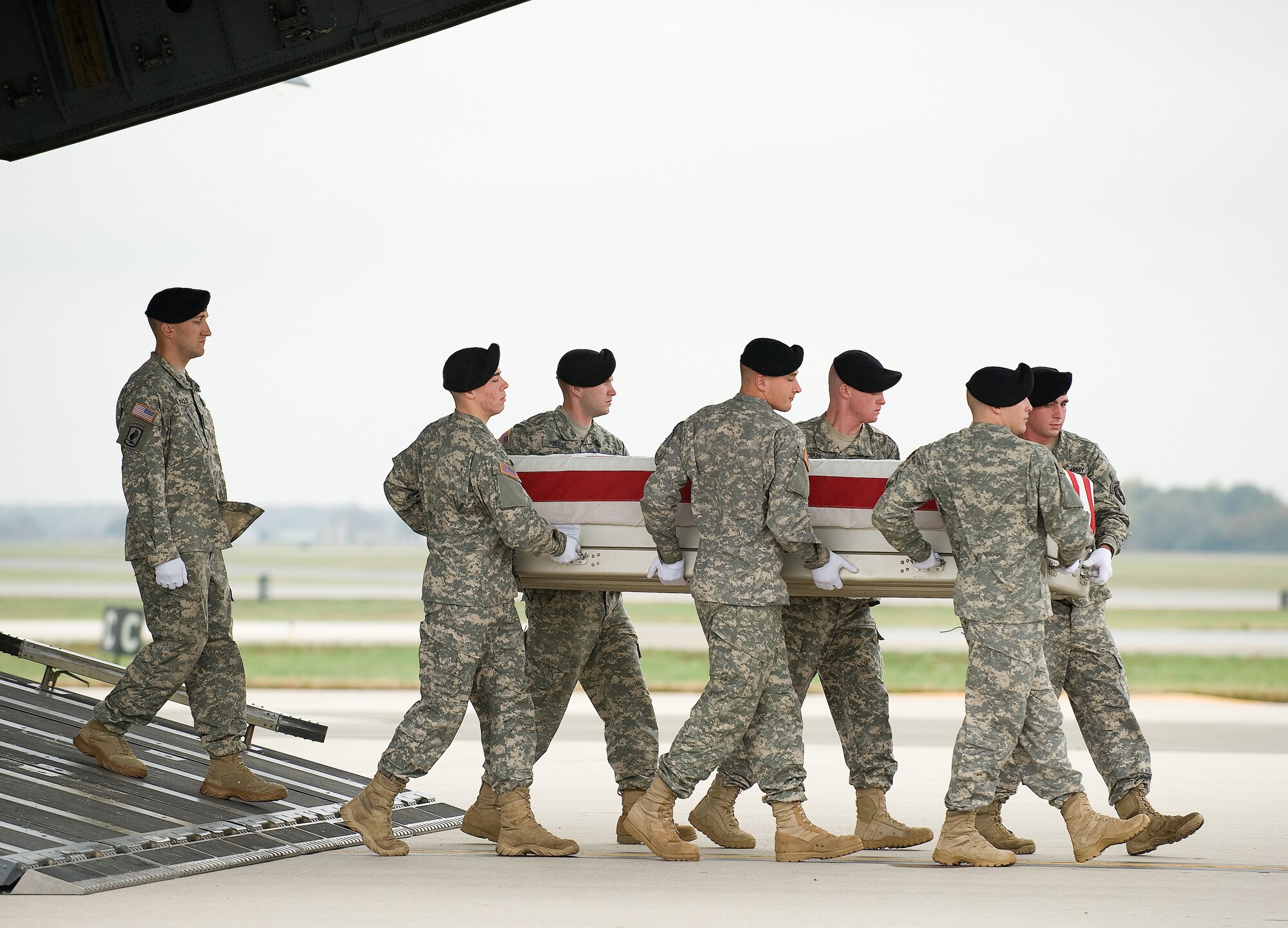 A U.S. Army carry team transfers the remains of Army Spc. Steven L. Dupont of Lafayette, La., at Dover Air Force Base, Del., Oct. 26, 2010. He was assigned to the 3rd Squadron, 2nd Stryker Cavalry Regiment, Vilseck, Germany. (U.S. Air Force photo/Jason Minto)