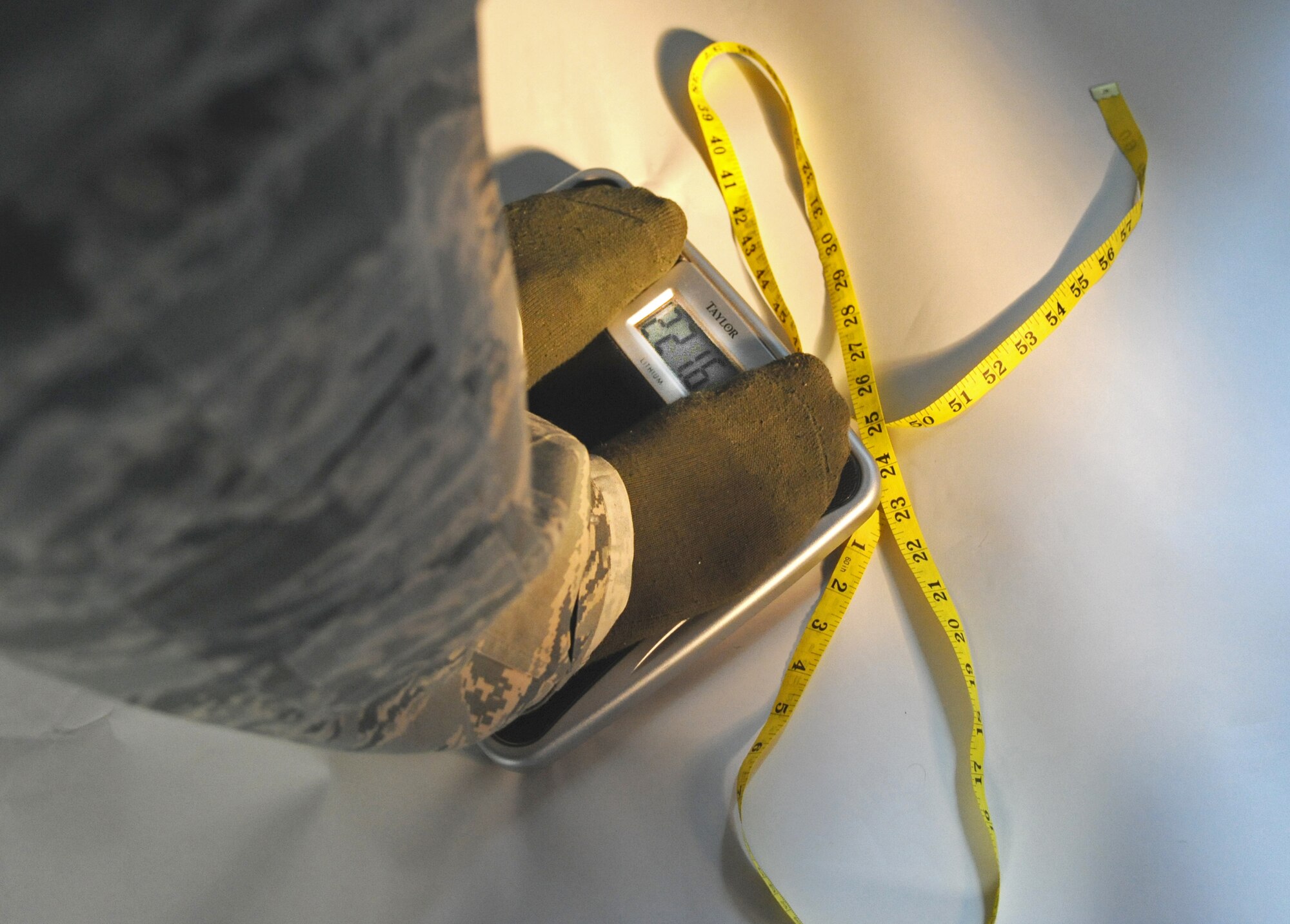 MINOT AIR FORCE BASE, N.D. -- The scale and the tape measure: possible enemies to anyone wanting to lose weight, especially since an abdominal circumference measurement is part of the Air Force physical fitness test. (U.S. Air Force photo by Senior Airman Michael J. Veloz)