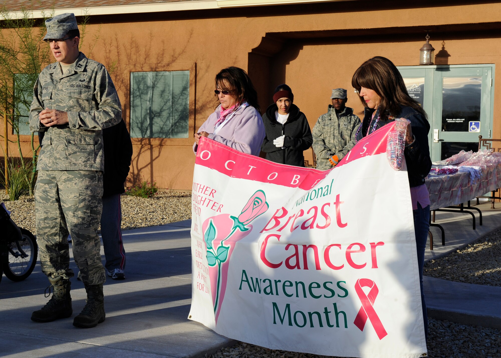 HOLLOMAN AIR FORCE BASE, N.M. -- Chaplain (Capt.) Kelly Stahl, 49th Wing Chapel, says a prayer before the Annual Breast Cancer Awareness Walk-a-Thon begins at the Soaring Heights Welcome Home Center Oct. 26, 2010. In honor of the annual Breast Cancer Awareness Month, members of Team Holloman arranged a Breast Cancer Awareness Walk-A-Thon. Participants in the walk included Soaring Heights staff, spouses and dependants with the 49th Civil Engineer Squadron Fire Protection Flight leading the way in a fire truck and the 49th Security Forces Squadron directing traffic. The mission of the event was to reach out to the public to let them know that early detection is key in the treatment of breast cancer. (U.S. Air Force photo by Airman 1st Class Eileen Payne/Released)