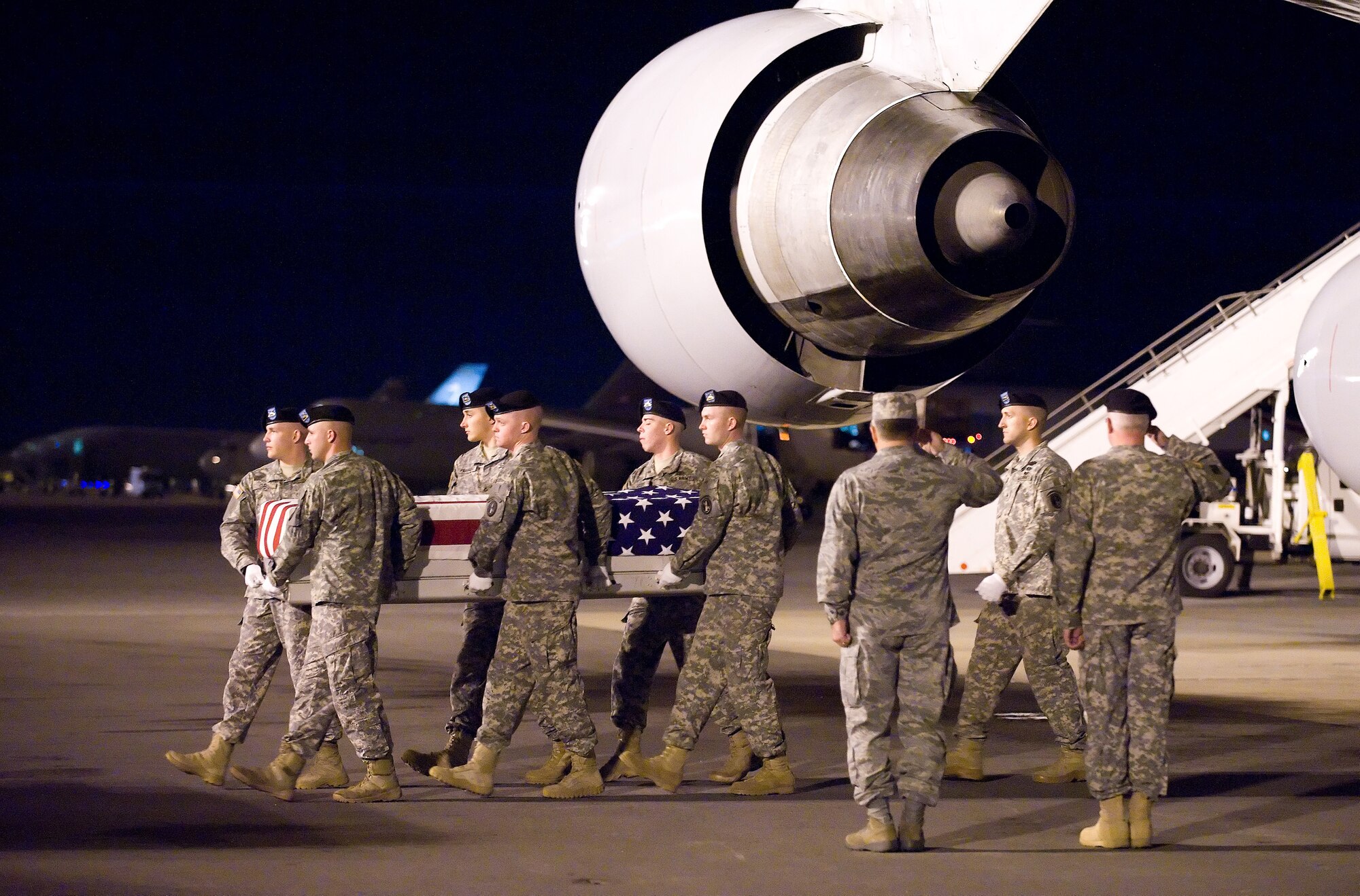 A U.S. Army carry team transfers the remains of Army Spc. Ronnie J. Pallares of Rancho Cucamonga, Calif., at Dover Air Force Base, Del., Oct. 25, 2010. He was assigned to the 27th Engineer Battalion, Fort Bragg, N.C. (U.S. Air Force photo/Jason Minto)