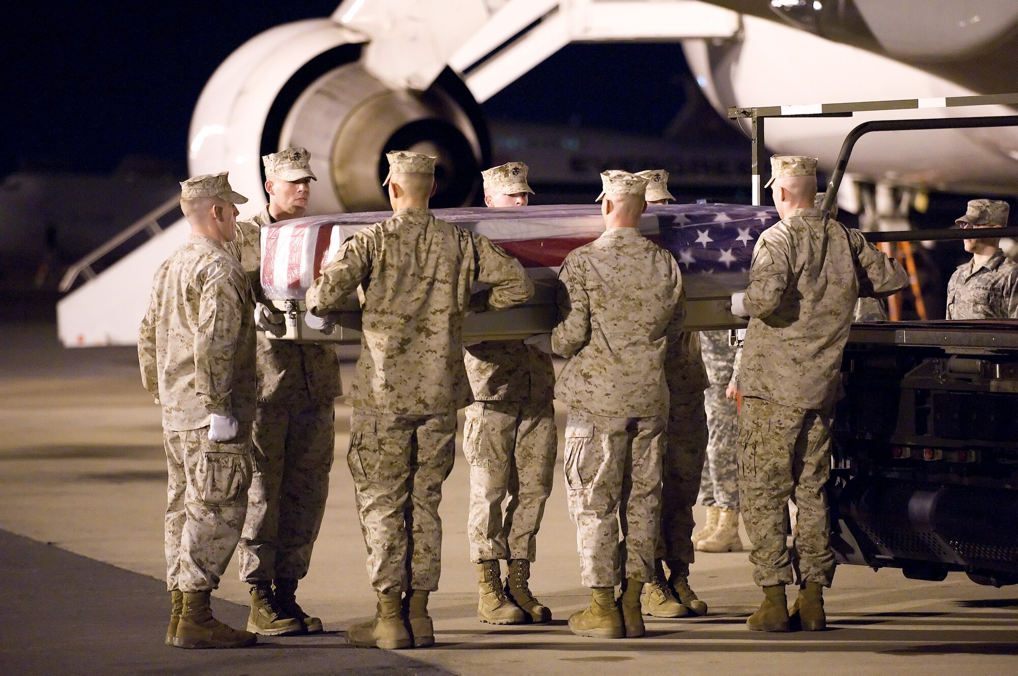 A U.S. Marine Corps carry team transfers the remains of Marine Lance Cpl. Francisco R. Jackson of Elizabeth, N.J., at Dover Air Force Base, Del., Oct. 21, 2010.  He was assigned to the 1st Battalion, 11th Marine Regiment, 1st Marine Division, I Marine Expeditionary Force, Camp Pendleton, Calif. (U.S. Air Force photo/Jason Minto)