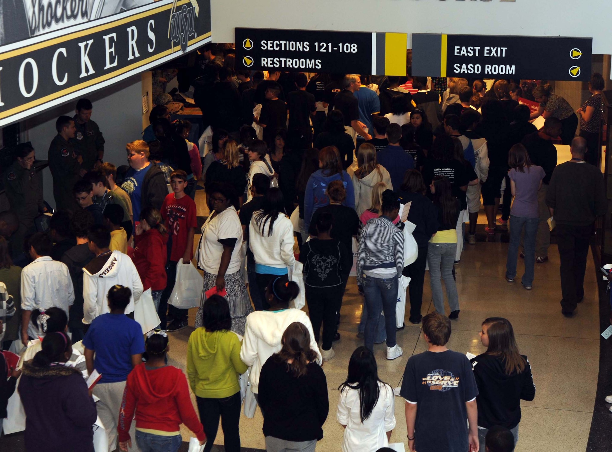 Eighth grade students from the community explore a variety of informational booths during the first Wichita Career Day held in the Koch Arena at Wichita State University, Oct. 20, 2010, Wichita, Kan.  More than 3,000 students from the community attended the event.  (Senior Airman Abigail Klein, U.S. Air Force photo/Senior Airman Abigail Klein)