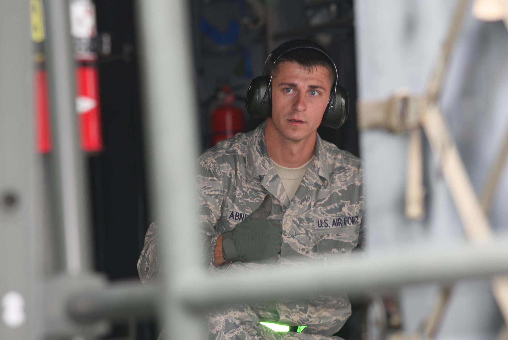 Tech. Sgt Morgan W. Abner, 96th Aerial Port Squadron, Little Rock Air Force Base, AR gives K-Loader operator and team member the thumbs up as they complete the K-load driving course during the 2010 Air Force Reserve Command Port Dawg Challenge here Oct. 26. (U.S. Air Force Photo/Don Peek)  

