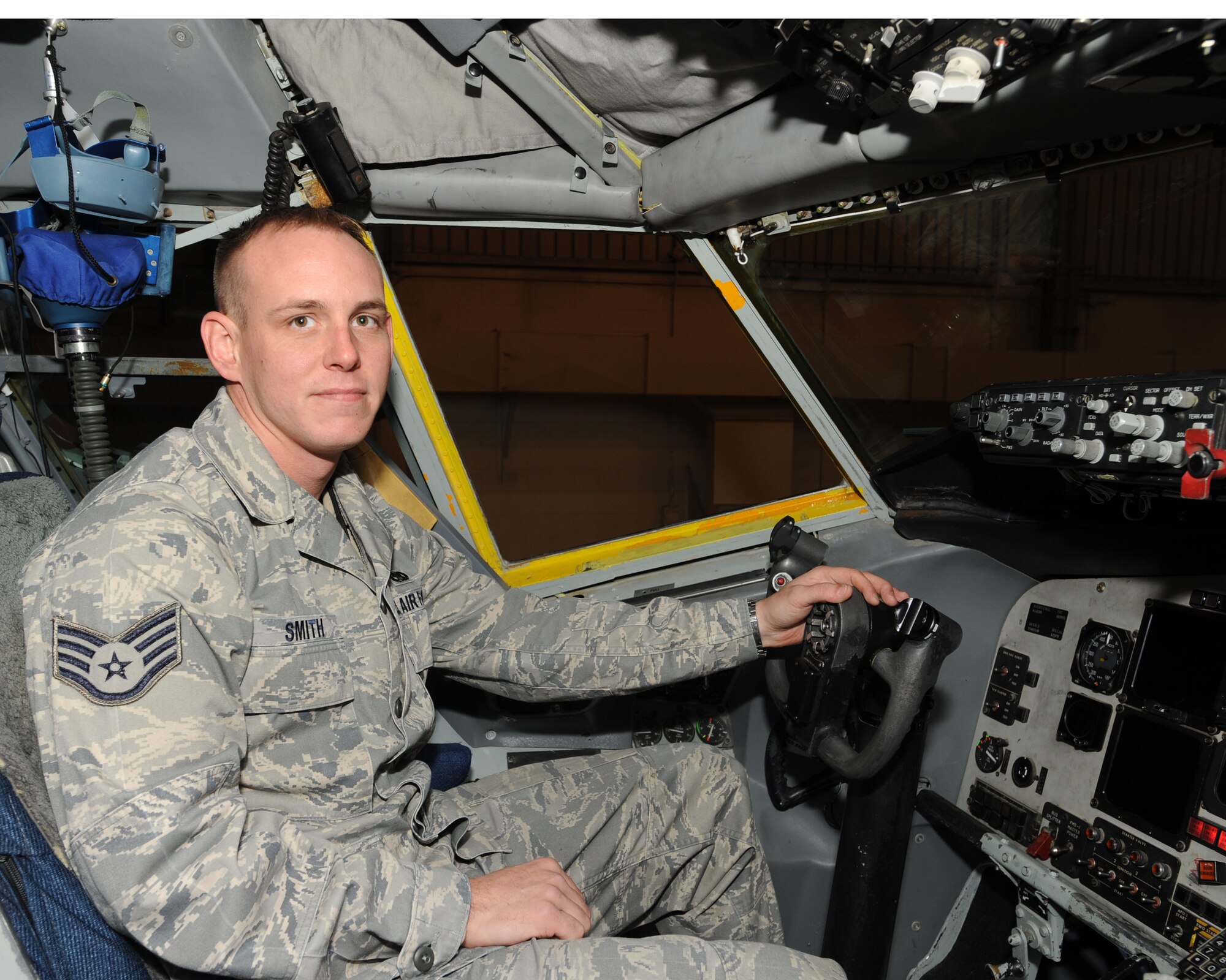 Staff Sgt. James Smith, 319th Aircraft Maintenance Squadron, poses for a photo  in the cockpit of a KC-135 Stratotanker Oct. 27 on Grand Forks Air Force Base, N.D. (U.S. Air Force photo by Staff Sgt. Suellyn F. Nuckolls)