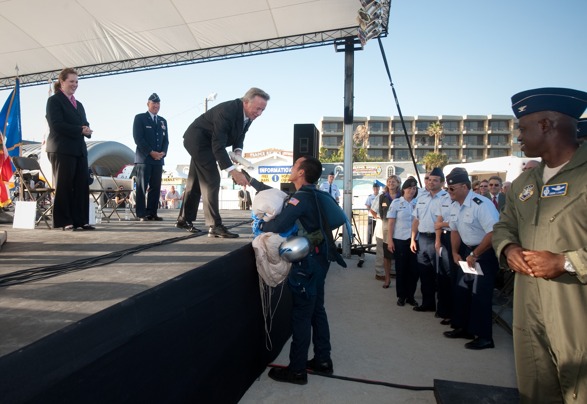 Air Force Academy Cadet Alexander Choi delivers the official proclamation certificate to Florida Lt. Governor Jeffrey Kottkamp to begin the Air Force Week Cocoa Beach proclamation ceremony Oct. 26, 2010.  Cadet Choi, a member of the Academy’s Wings of Blue parachute team jumped from a C-130 Hercules and landed on the Cocoa Beach, Fla., waterfront to deliver the certificate.  The proclamation ceremony was officiated by Mr. Kottkamp and Undersecretary of the Air Force Erin C. Conaton.  Air Force Week Cocoa Beach runs through Oct. 31.  (U.S. Air Force photo/Lance Cheung)