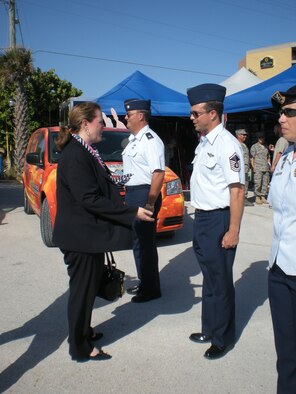COCOA BEACH, Fla. - The Undersecretary of the Air Force, Ms. Erin Conaton, recognized hometown heroes from nearby Patrick Air Force Base during Air Force Week opening ceremonies Tuesday, Oct. 26, at the Cocoa Beach Pier. Central Florida was selected as one of two locations where AF week is held. Master Sgt. Shane Smith, a combat search and rescue reservists with the 920th Rescue Wing is shown being recognized by the undersecretary. Sergeant Smith was there in uniform even though he is  still officially on reconstitution leave from his latest deployment that ended less than a week ago to the Horn of Africa as an HC-130P/N King loadmaster (U.S. Air Force photo/Staff Sgt. Michele Gibson).