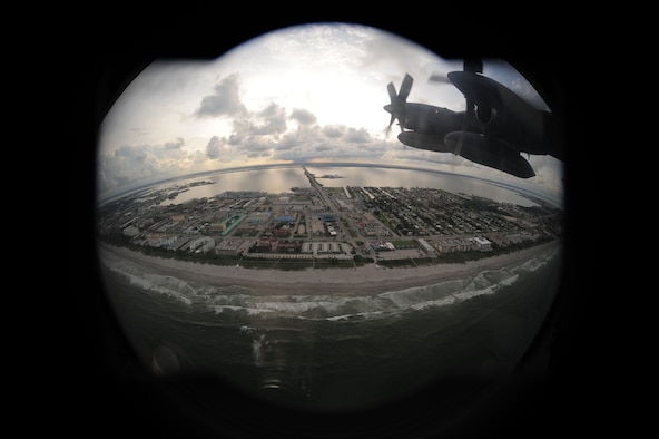COCOA BEAFCH, Fla. - The City of Orlando, Known as America's playground and the endless summer sanctuary that is Cocoa Beach, have become staging spots for this year's Air Force Week, a culmination of recruiting magnificence that happens only twice a year at select locations. The first was in New York City earlier this year. Here, a photo of Cocoa Beach is snapped by an HC-130P/N King crew member prior to a 920th Rescue Wing aerial demonstration. (U.S. Air Force photo/Master Sgt. Rob Grande)