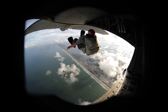 COCOA BEAFCH, Fla. - The City of Orlando, Known as America's playground and the endless summer sanctuary that is Cocoa Beach, have become staging spots for this year's Air Force Week, a culmination of recruiting magnificence that happens only twice a year at select locations. The first was in New York City earlier this year. Here a 920th Rescue Wing pararescuman from Patrick Air Force Base parachutes into the Atlantic Ocean of the coast of Cocoa Beach during a water rescue demonstratoin. (U.S. Air Force photo/Master Sgt. Rob Grande)