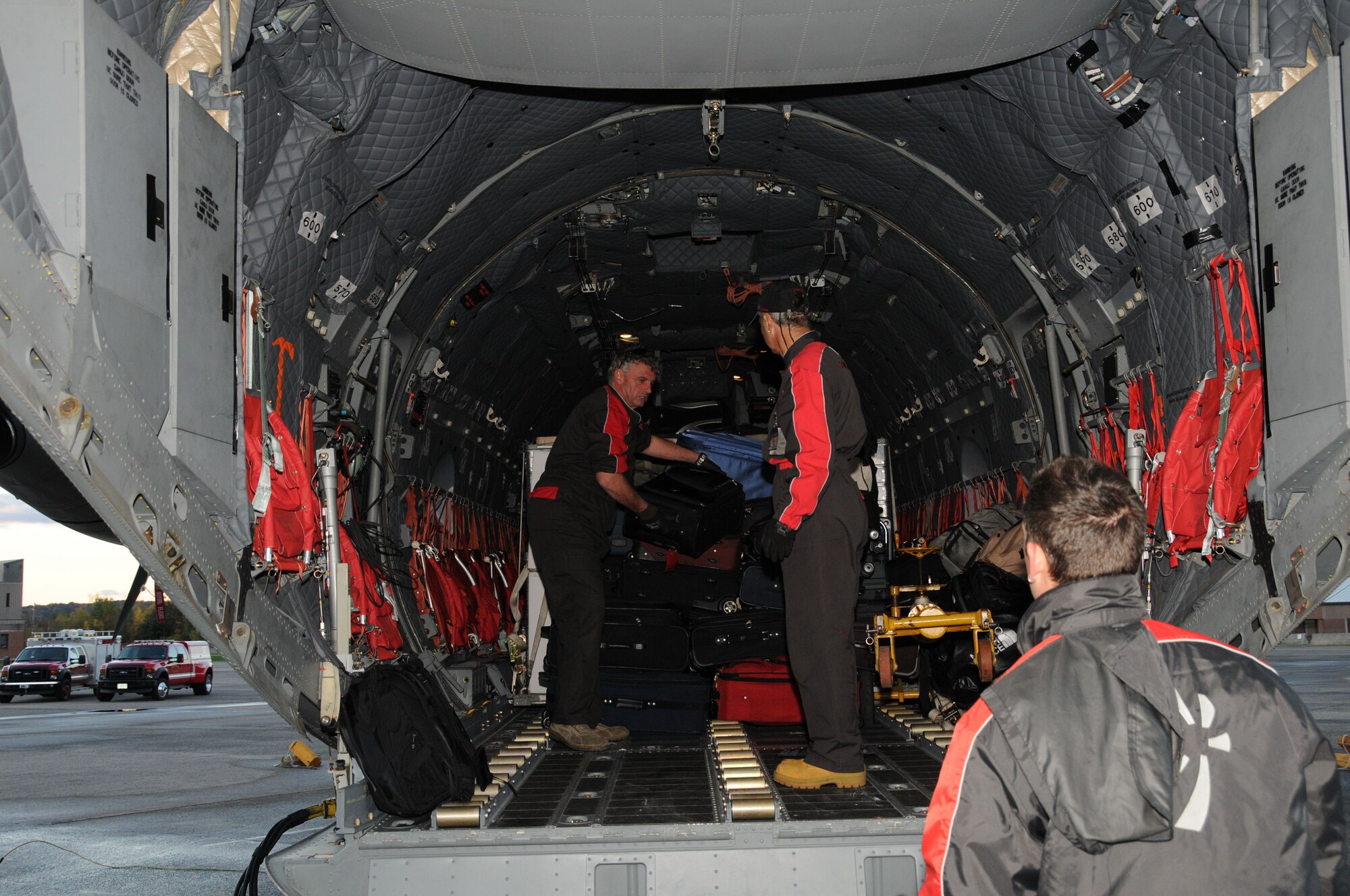 Aircrew of Alenia Aeronautica unload the new C27J Spartan upon its arrival to the Bradley Air National Guard Base in East Granby, Conn. on Thursday, Oct. 21, 2010.  The aircraft visit afforded the Flying Yankees of the 103rd Airlift Wing an opportunity to experience its future mission capabilities first hand.  (U.S. Air Force photo by Tech. Sgt. Erin E. McNamara)