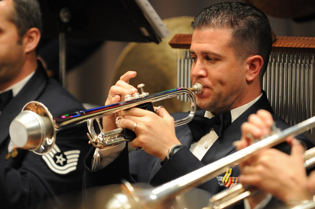 BALTIMORE --Tech. Sgt. Christian Pagnard, member in the U.S. Air Force Band, plays the trumpet Oct. 22 at Northwestern High School, Baltimore, Md. The performance is the 17th on the band’s three-week 2010 Fall Tour. (U.S. Air Force photo by Senior Airman Christopher Ruano)