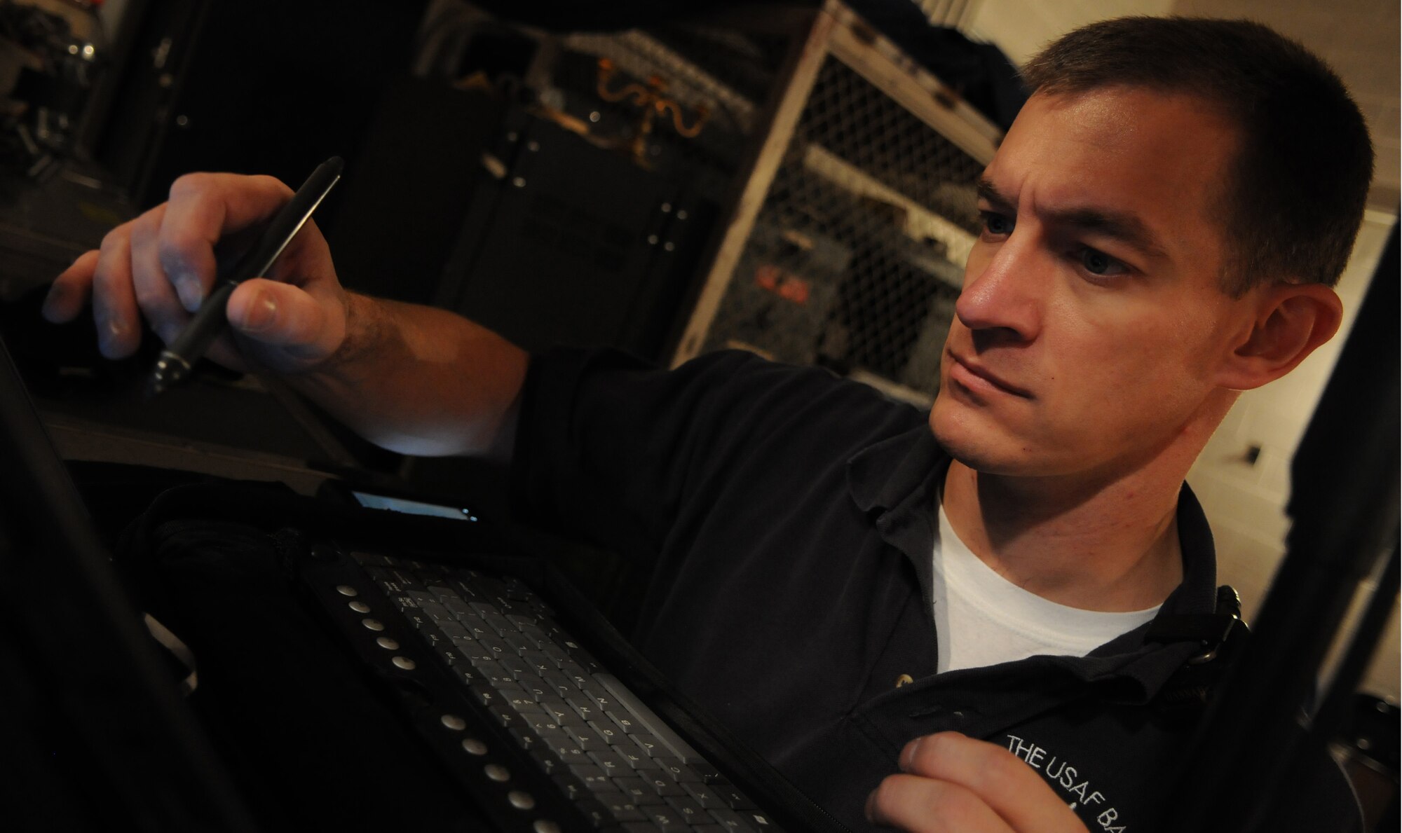 BALTIMORE -- Master Sgt. Mark Hannah, audio engineer in the U.S. Air Force Band, scans for open frequencies during a performance Oct. 22 at Northwestern High School, Baltimore, Md. The audio engineer designs and adjusts the audio product using electronics, before amplifying the final product for the audience. (U.S. Air Force photo by Air Force Senior Airman Christopher Ruano)